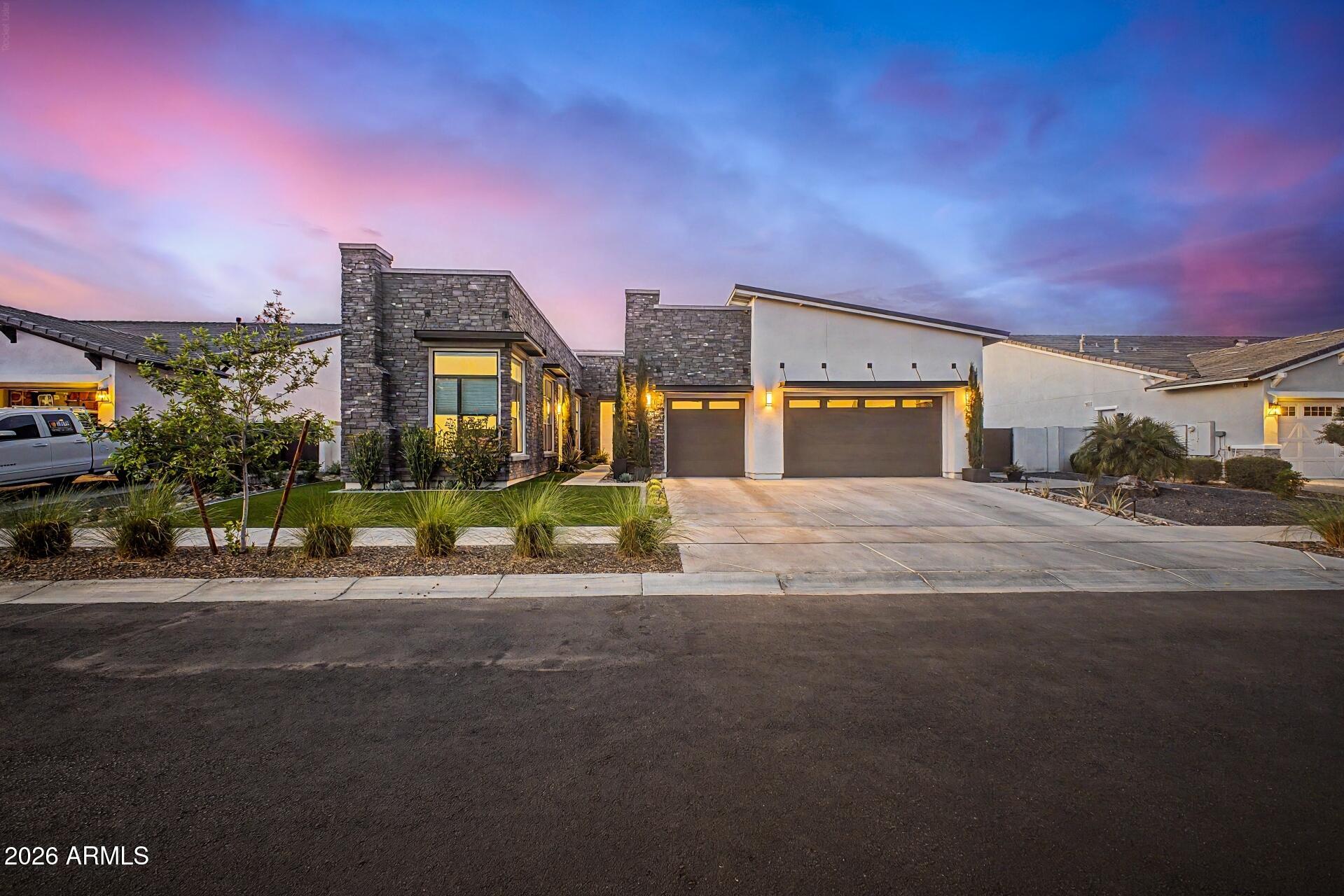 Modern desert luxury meets seamless indoor-outdoor living in the prestigious Bridle Ranch community.

Designed with soaring ceilings, walls of glass, and beautiful natural light throughout, this stunning home offers an elevated yet peaceful Arizona lifestyle with clean architectural lines and expansive open-concept living.

The gourmet kitchen features premium appliances, stacked cabinetry, an oversized waterfall island, and effortless flow into the dramatic great room and expansive sliding glass doors -- creating the perfect setting for entertaining, relaxing, and unforgettable Arizona sunsets.

The thoughtfully designed split floor plan includes 3 spacious bedrooms, 2.5 baths, and a versatile office/flex space. A private, separate entrance casita with its own living area, kitchen, bedroom, and bath offers incredible flexibility for guests, multigenerational living, a luxury office, a gym, or a creative retreat.

The backyard offers the opportunity to create a truly personalized resort-style oasis with ample space for a custom pool, spa, pergola, and outdoor entertaining. Lifestyle renderings are included to help inspire the vision and incredible potential of this luxury retreat.

Additional highlights include owned solar, a 3-car garage, designer finishes throughout, and a prime Queen Creek location near Horseshoe Park, Pecan Lake Entertainment, San Tan Flat, dining, recreation, and more.