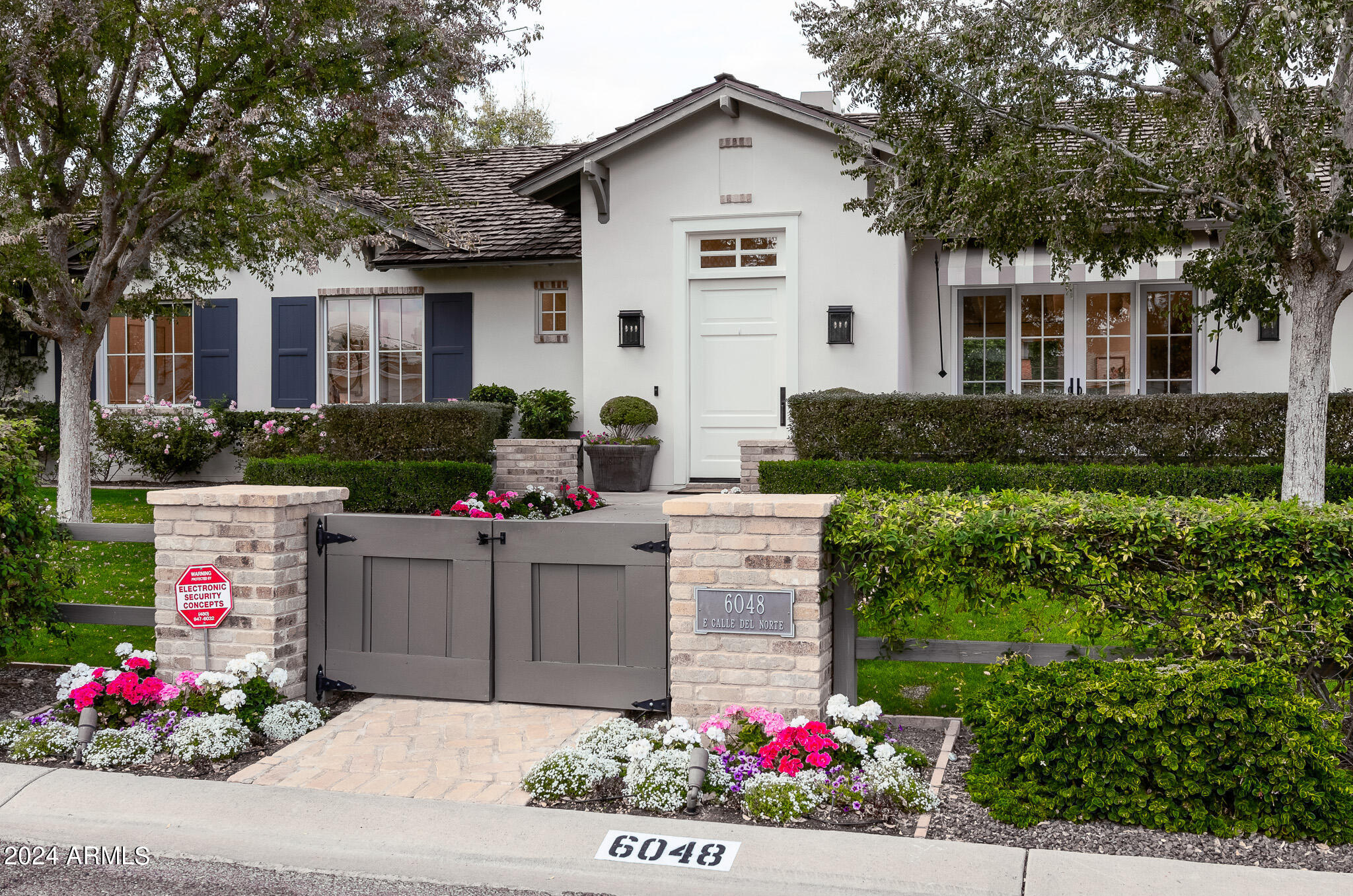 Here is the dreamy Arcadia Modern Farmhouse you have been waiting for. This beautifully newly built home, sits on a premium lot with Camelback views. Drawing you in with lush landscape, walk through the gates & enter to the inviting front patio living space and you will be captivated. Once inside you are greeted with an open concept, boasting rich wood floors, vaulted ceilings with beams, and details everywhere you look. The gourmet kitchen is perfect for entertaining and includes a large kitchen island, quartz countertops, SS appliances & a farmhouse sink. Step inside the oversized  primary bedroom and continue to the spa-like bathroom. The generously sized guest bedrooms are inviting and all the guest bathrooms showcase subway tile, quartz countertops &  beautiful cabinetry. The ... backyard boasts beautiful lush landscaping designed by Berghoff Design Group, an oversized patio and plenty of room for everyone to play! Do not miss out on this opportunity.