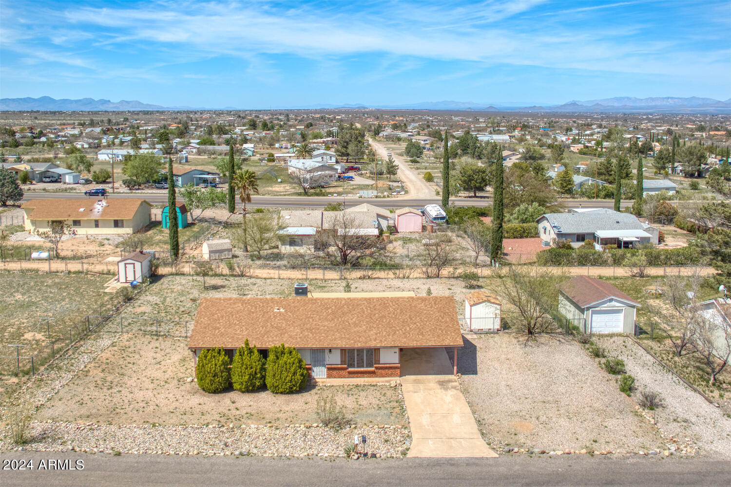 Welcome to your slice of paradise in this picturesque backdrop, boasting breathtaking views of the majestic Huachuca Mountains. This charming 3 bedroom, 2 bathroom home is situated on a sprawling third of an acre lot, offering tons of privacy.

Step inside this meticulously maintained home and be greeted by an abundance of natural light streaming through the windows into the Living Room.

The heart of the home, the kitchen, features ample cabinet and couterspace, pantry, a convenient breakfast bar, perfect for culinary enthusiast and casual dining alike. 

Adjacent to the kitchen, a near complete Arizona Room awaits, providing additional living space for year-round enjoyment. With windows, doors, insulation, and electrical already in place.

Don't miss seeing this home today!