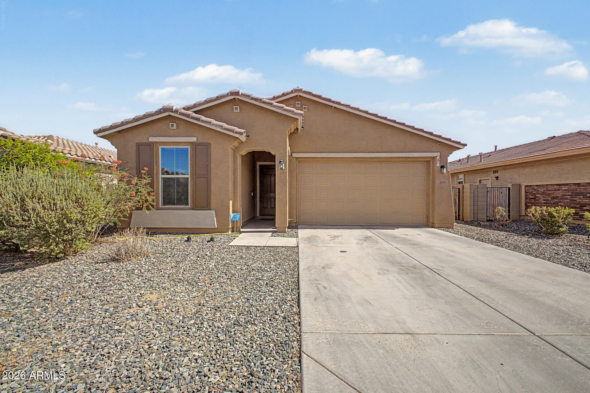 Discover this charming 3-bedroom home with a great curb appeal, a manicured landscape, and a 2-car garage! Inside, you'll find sizable living spaces ready to bring you joy, showcasing tile flooring, contemporary lighting, sliding doors to the patio, and neutral colors. The impeccable kitchen displays staggered cabinets with crown molding finishes, tile backsplash, sleek granite counters, SS appliances & an island, perfect for quick bites and casual conversations. The primary bedroom is a true retreat, offering a practical walk-in closet & a private bathroom with dual sinks and a separate shower & tub. Gather with your loved ones in the backyard, including a covered patio perfect for morning coffee, ample seating space, and a shed for added organization. What's not to love? Make it yours!