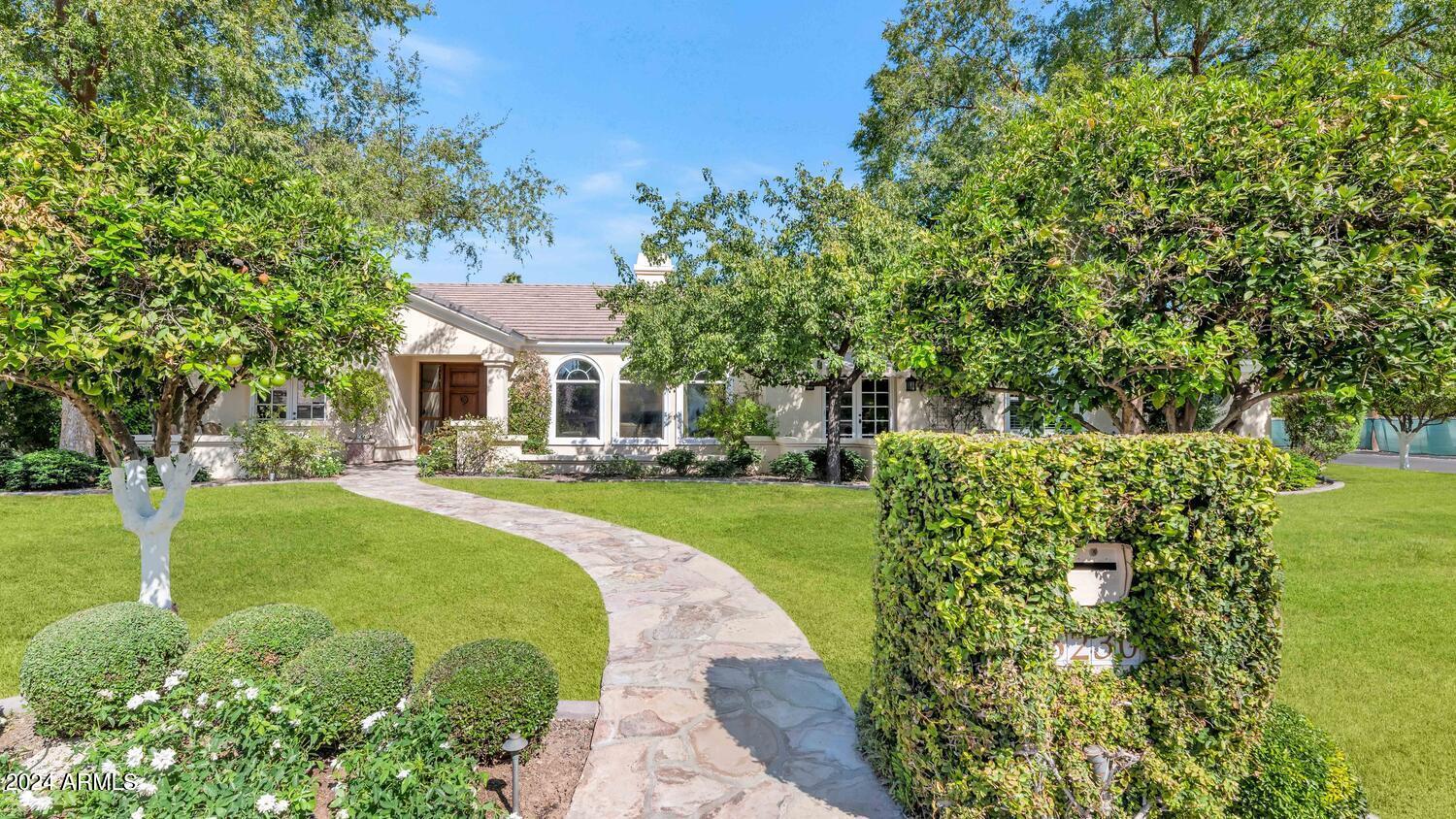 This beautiful sprawling ranch has a perfect open floor plan and loads of charm and character. The upscale island kitchen has double ovens, double dishwashers, warming drawer, custom cabinetry, and a breakfast bar, the great room is lined with french doors creating a bright sun filled space, the formal living and dining rooms are great for intimate family gatherings as well as large scale entertaining, there's a fantastic custom built home office, and the impressive primary suite has an extra large bath. Sitting in a highly sought after Arcadia neighborhood, the oversized lot houses a gorgeous pool, built-in barbecue, large covered patio, and super mature, lush grounds. This home is wonderful as is, yet it has endless potential to go to the next level!