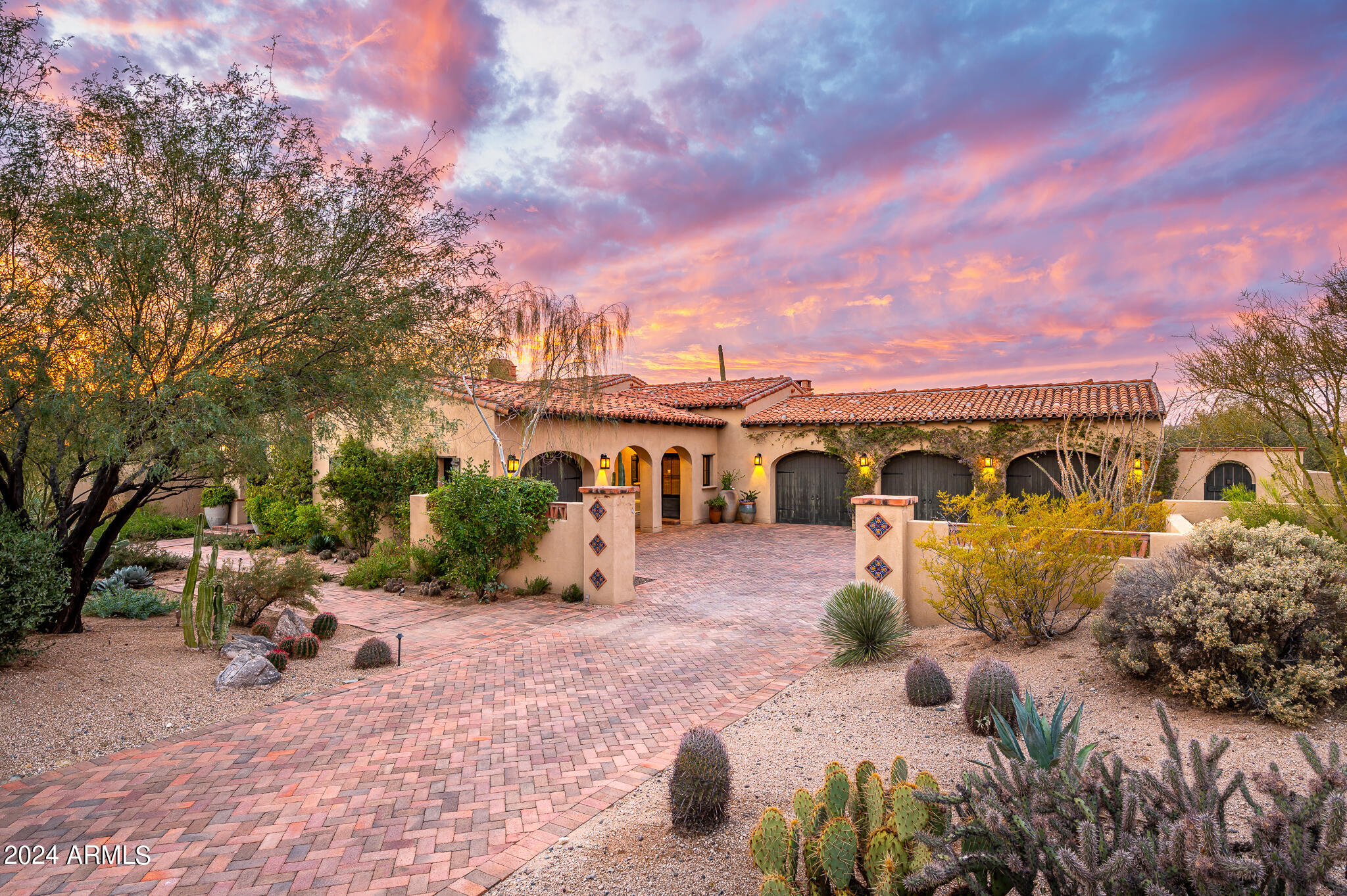 Charming Hacienda-inspired home in the guard-gated community of Whisper Rock Estates * Sited on a 1.15 acre lot, this property is the ultimate combination of privacy and views * Thoughtful floor plan with the great room, hearth room, and formal dining room all centered around the expansive chef's kitchen * Numerous french doors open to enchanting outdoor spaces: front courtyard with fireplace, multiple covered patios, private ramada, and lush mature vegetation * Romantic primary retreat complete with fireplace, dual closets, his/her baths and exercise room * Authentic finishes include wood beam ceilings, painted accent tiles, 5 gas fireplaces, slab granite surfaces, furniture-grade cabinetry, wolf/sub zero appliances * Two additional guest suites, full guest casita, wine room, and office