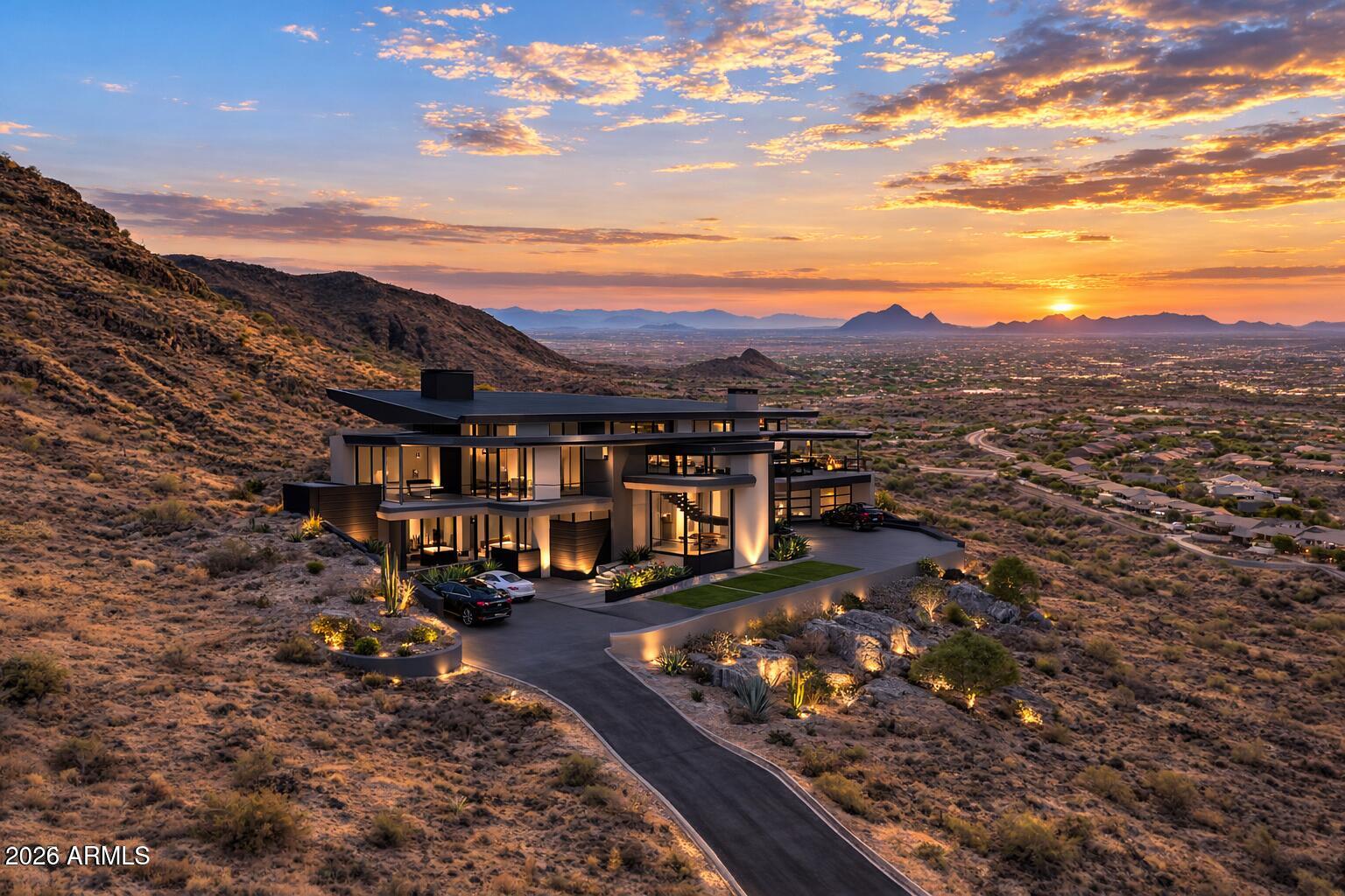 Discover a rare opportunity to own a breathtaking 11-acre mountain top lot in the prestigious City of Scottsdale. Nestled at the end of a serene cul-de-sac, this exclusive property offers unparalleled privacy and awe-inspiring 360-degree mountain views, including stunning vistas of Camelback and Mummy Mountains. Marvel at the glittering city lights below, creating a perfect blend of natural beauty and urban proximity. Just +/-25 minutes to the upscale Fashion Square Mall and +/-30 minutes to Sky Harbor Airport. Build your dream estate on this expansive lot, where luxury meets nature in one of Scottsdale's most sought-after locations. Own your own mountain top and experience the pinnacle of Arizona living!