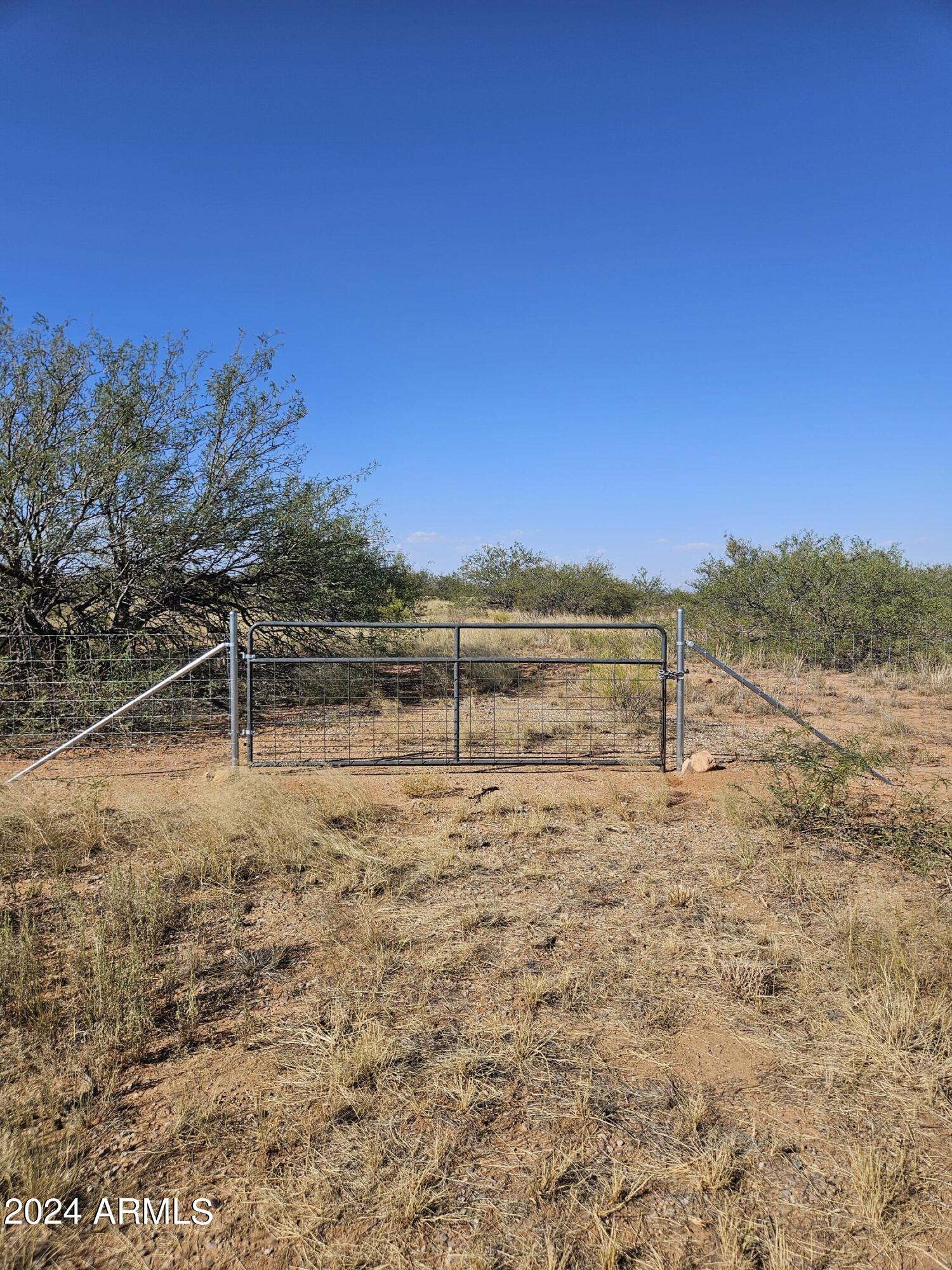 Beautiful 7.27 acre parcel. With 4 on the Well Share. Horse Property on Paved Three Canyons Blvd. Professionally fenced recently on three sides with field fence. Future home can be set back from main road for more privacy due to the rectangular lot shape. Property offers a good balance of nice sized Mesquite trees and level open areas. Over all a very nice lot with good mountain views.