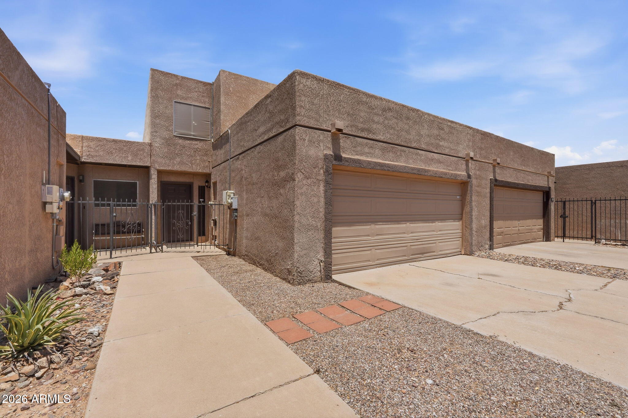 Home, sweet home in Casa Grande Townhomes! This inviting residence features a semi-open floor plan with a spacious living room highlighted by exposed beams, designer paint, tile flooring, and wood laminate in all the right places. The kitchen offers stainless steel appliances, granite countertops, rich wood cabinetry, and a peninsula with breakfast bar seating. Upstairs, you'll find comfortable bedrooms, including a primary suite with dual closets and an ensuite bath featuring double sinks. Step outside to your private patio--ideal for morning coffee, evening relaxation, or weekend BBQs. Enjoy easy access to the community pool and a convenient Casa Grande location near shopping, dining, and everyday amenities