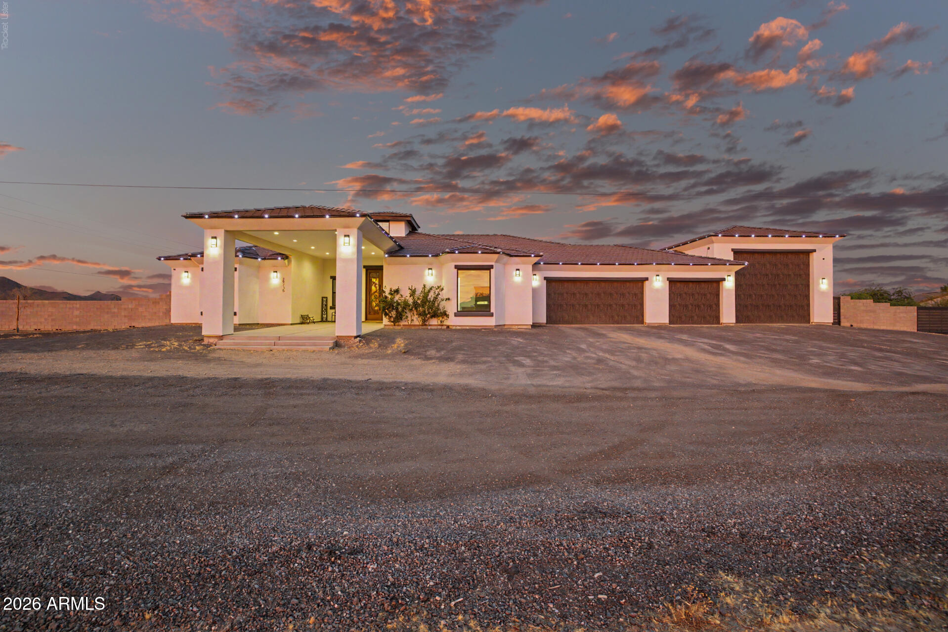 Prepare to be amazed! Check out this fantastic 5 bed, 6 bath residence now for sale in Surprise! Nestled on an oversized acre lot & featuring great curb appeal, a 3 car garage plus an RV garage and two RV gates, it's sure to be the home for you! Come inside to discover a spacious open concept w/high ceilings, dazzling light fixtures, soothing palette throughout, and a fireplace to keep you warm & cozy. The chef's kitchen is comprised of painted cabinetry w/crown moulding, a pantry, leather finished granite counter tops, SS appliances, 2 islands, and a lovely breakfast bar. Relax & unwind in the grand primary suite, boasting plush carpet, a walk-in closet, and a lavish bath w/dual sinks. You'll also find a quaint open den ideal for an office or reading nook. Lastly, the expansive backyard includes a covered patio, artificial turf, rooftop deck access, and a sparkling blue pool! The home of your dreams is here, don't let it get away!