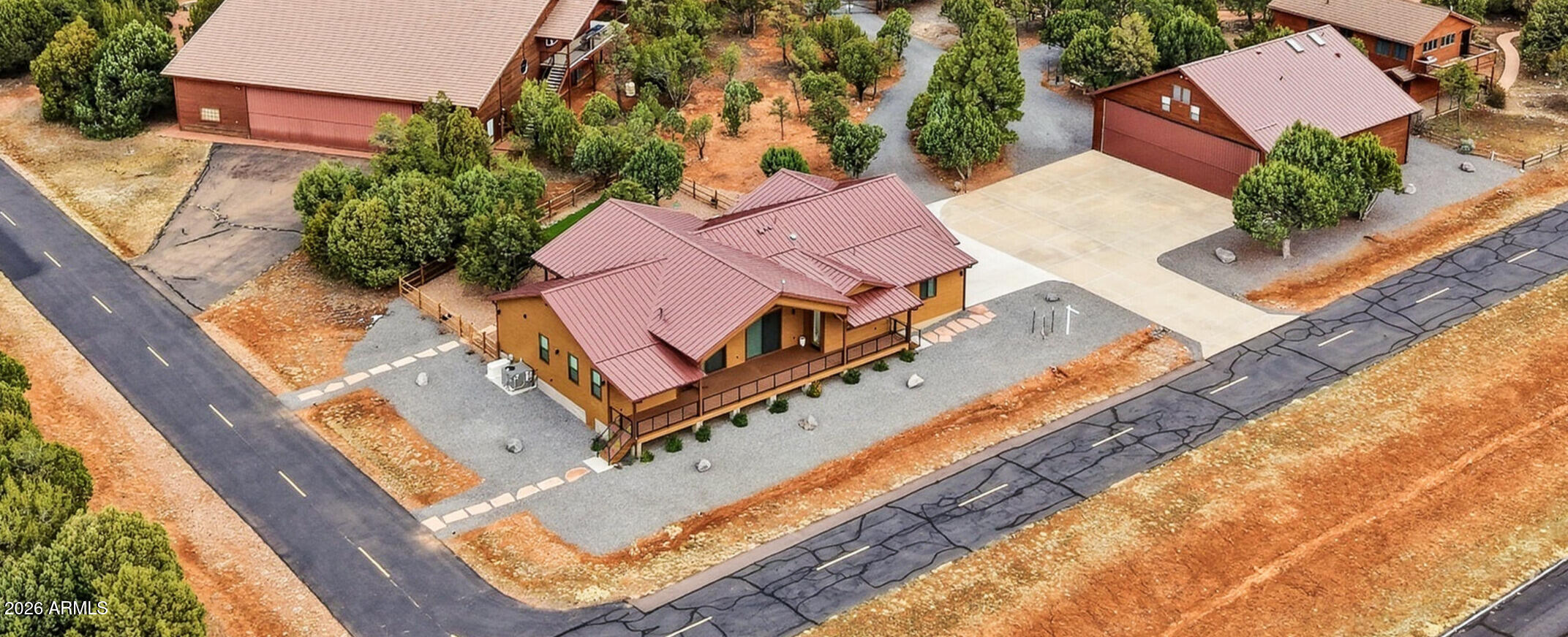 Set on nearly one acre at midfield in Mogollon Airpark (AZ82), this exceptional property offers the perfect base for flying and enjoying Arizona's White Mountains. The owners built this as their forever home, sparing no expense to achieve the finest in craftsmanship, comfort, and functionality. Designed for aviators and adventurers who demand the best, this 2022 custom-built residence combines upscale mountain living with a 50' x 50' aircraft hangar w/ guest apartment, an oversized 4-car garage, and panoramic 180-degree runway views that put you front and center to the action. The thoughtfully designed 3-bedroom, 2-bath home showcases meticulous attention to detail—an open floor plan with high-end finishes, LP SmartSide siding, Trex composite decking, LVP flooring, whole-house humidifier, spray foam insulation, and backup generator for peace of mind. The chef's kitchen boasts a waterfall quartzite island, designer backsplash, GE Profile appliances, a 5-burner range, and a spacious walk-in pantry.

The 2,500 sq ft hangar is equipped with a Schweiss bi-fold door (45' opening with 13' vertical clearance), propane heater, epoxy flooring, sink, and urinal. 2025 updates include a new metal roof, skylights, gutters with underground drainage, and fresh exterior stain. Above the hangar, the furnished 800 sq ft apartment offers a full kitchen, central heating and cooling, and washer/dryer hookups, perfect for guests or extended stays. 

The spacious 4-car garage features epoxy floors, spray-foam insulation, and 220V outlets ready for EVs or workshops. Step outside to your back deck or porch for breathtaking sunsets and clear views of aircraft taxiing, taking off, and landing. This midfield location isn't just desirable, it's among the most coveted spots in the community, offering both privacy and direct runway access.

Mogollon Airpark is more than a place to live, it's a lifestyle. Perched at 6,657 feet elevation and just 90 nautical miles northeast of Phoenix, it offers cool summers, mild winters, and endless adventure in every direction. The surrounding White Mountains are packed with opportunities for fishing, off-roading, hiking, exploring forest trails, boating on nearby lakes, and enjoying the charm of a no-box-store small-town community. Here, you'll trade big-city rush for open skies, friendly neighbors, and active EAA gatherings that celebrate the spirit of flight year-round.

This property represents the pinnacle of airpark living, a home built with love, precision, and pride at one of Arizona's most desirable aviation addresses.

Home built in 2022; hangar built in 2002.