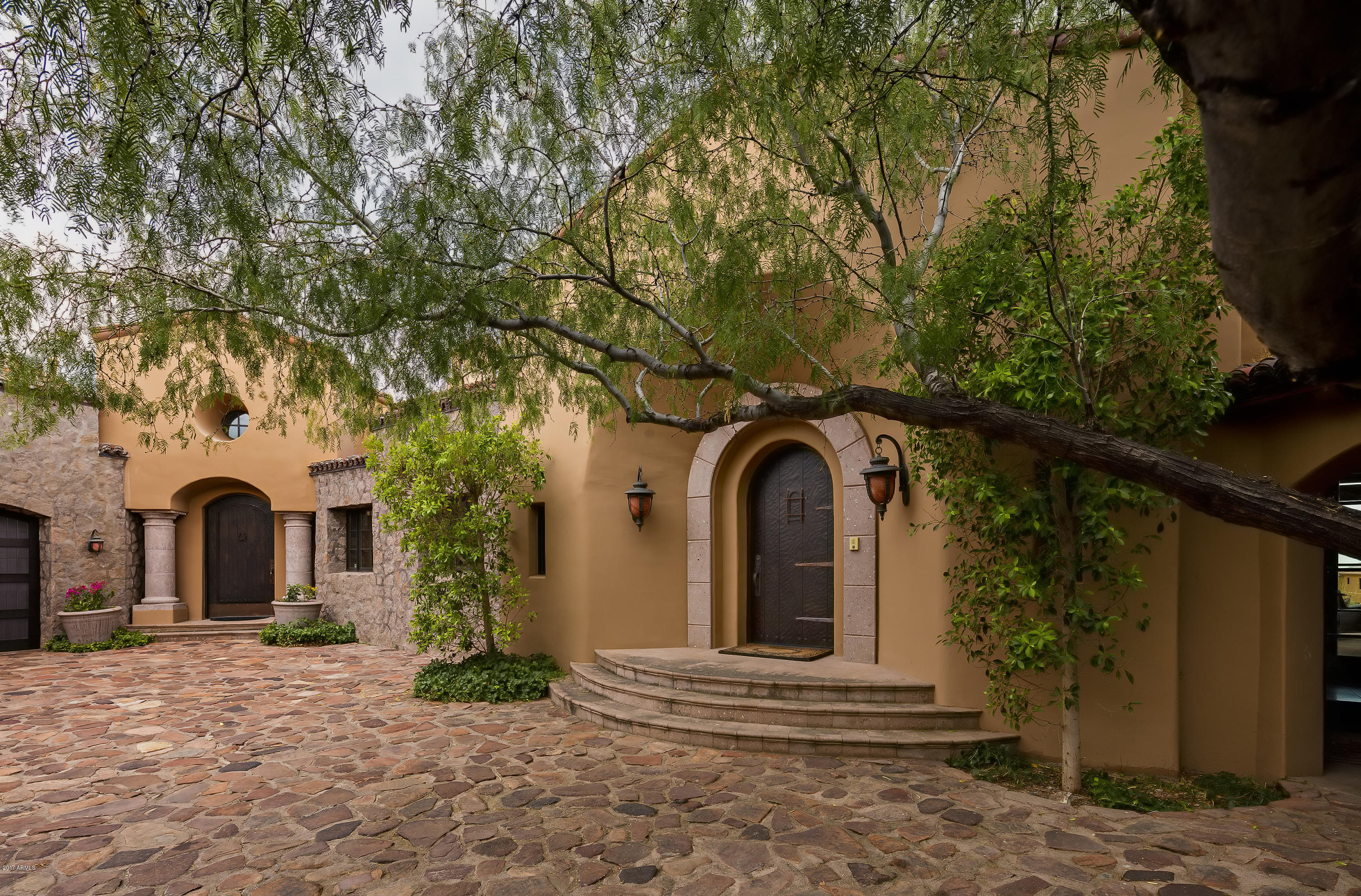 Reminiscent of a Wine Country estate, this Italian-style residence could be purchased turn-key including a convertible Mercedes!  Offers panoramic views of the 9th Chiricahua fairway, mountains, sunsets and sparkling city lights. The light interiors showcase beautiful Arizona nature & sunny skies. The resort patio captures breathtaking Arizona sunsets.
Enter through the picturesque porte cachere into a charming auto court revealing a magnificent arched entry door and covered breezeway which connects to the private casita.  Other architectural details include native stone façade, Cantera stone columns & mouldings, limestone fireplaces, handsome beams, vaulted brick ceilings, and Italian marble and African mahogany floors. Chef's kitchen remodeled in 2017 Tilting European windows in the Master BR offer sunrise and sunset views.
Enjoy resort living at its finest with multiple patios, facing east, south & west, sheltered dining, sunny patio spaces, outdoor fire features, infinity pool & spa, outdoor kitchen, wood-fired pizza oven and upper view-deck.
Recent updating includes exterior painting, interior painting and plaster work, window treatments, remodeled kitchen, new carpet, LED lighting and upgraded landscaping.
All in world-renowned Desert Mountain Community offering a unique lifestyle of 6 Nicklaus golf courses, tennis, croquet, pickle ball, fitness, hiking, horseback riding, spa, and 6 restaurants.
Conveniently located in the heart of Desert Mountain, close to the Saguaro Forest Village gate-house  and within easy walking distance to the Cochise, Geronimo and Chiricahua Club Houses.