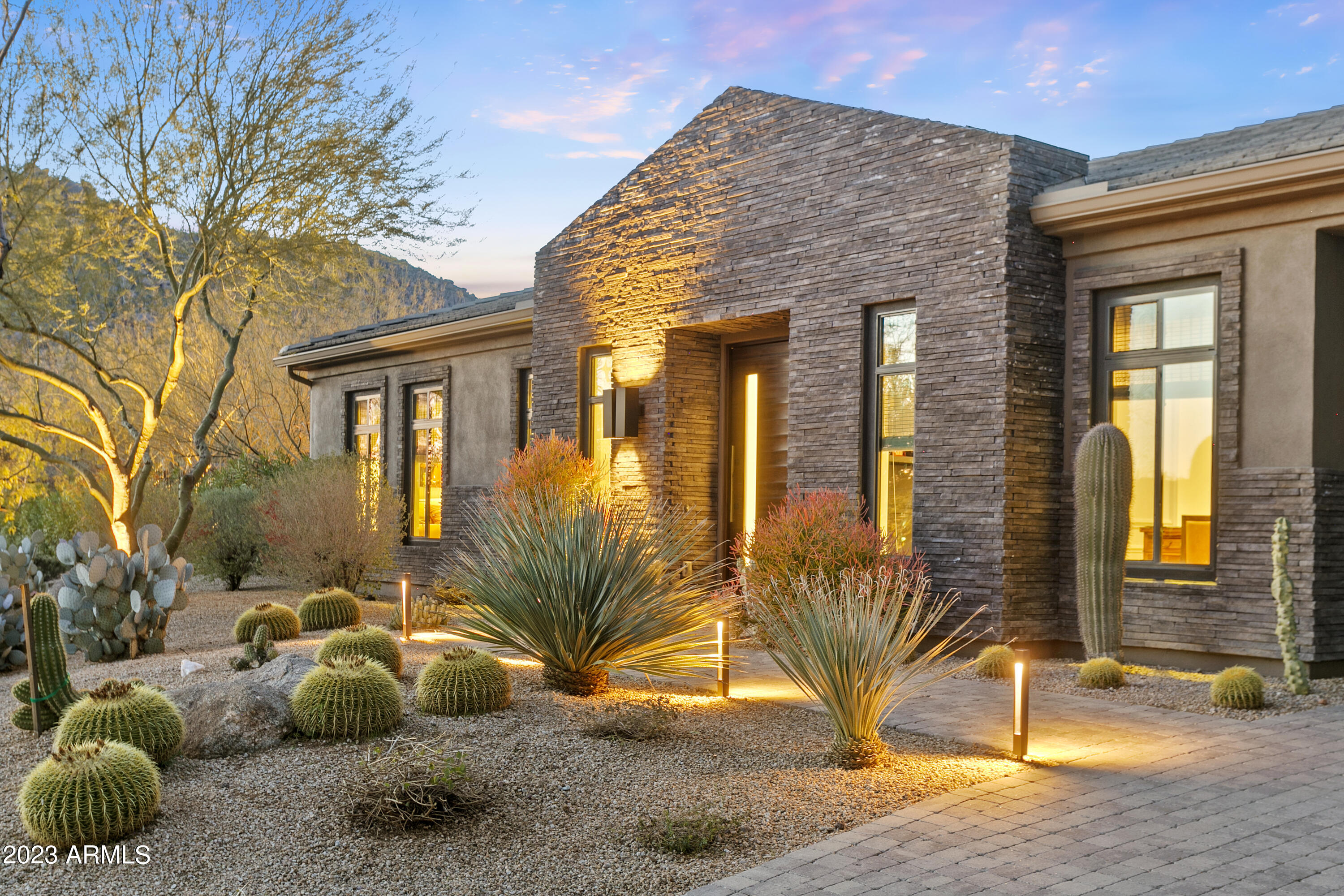 This is your opportunity to own in the highly sought-after Boulder Mountain Estates. Featuring the elegant modern European designs of internationally acclaimed Dutch designer Piet Boon, the home's spacious sophistication begins from the moment you walk through the front door and flows to every aspect of the residence including the 526sf guest house. Be captivated by spectacular, intimate views of both Troon Mountain and Tom's Thumb. With tons of natural light and seamless indoor/outdoor living, this home is ready to both entertain friends and family as well as be your own quiet preserve. The pristine kitchen with its subtle lines and stunning white cabinetry overlooks an expansive great room flowing to a beautiful resort-style pool area in a peaceful natural desert setting. The master suite boasts of two oversized walk-in closets with a spa-like bathroom. Views abound from every room in this home, making it a true must-see.