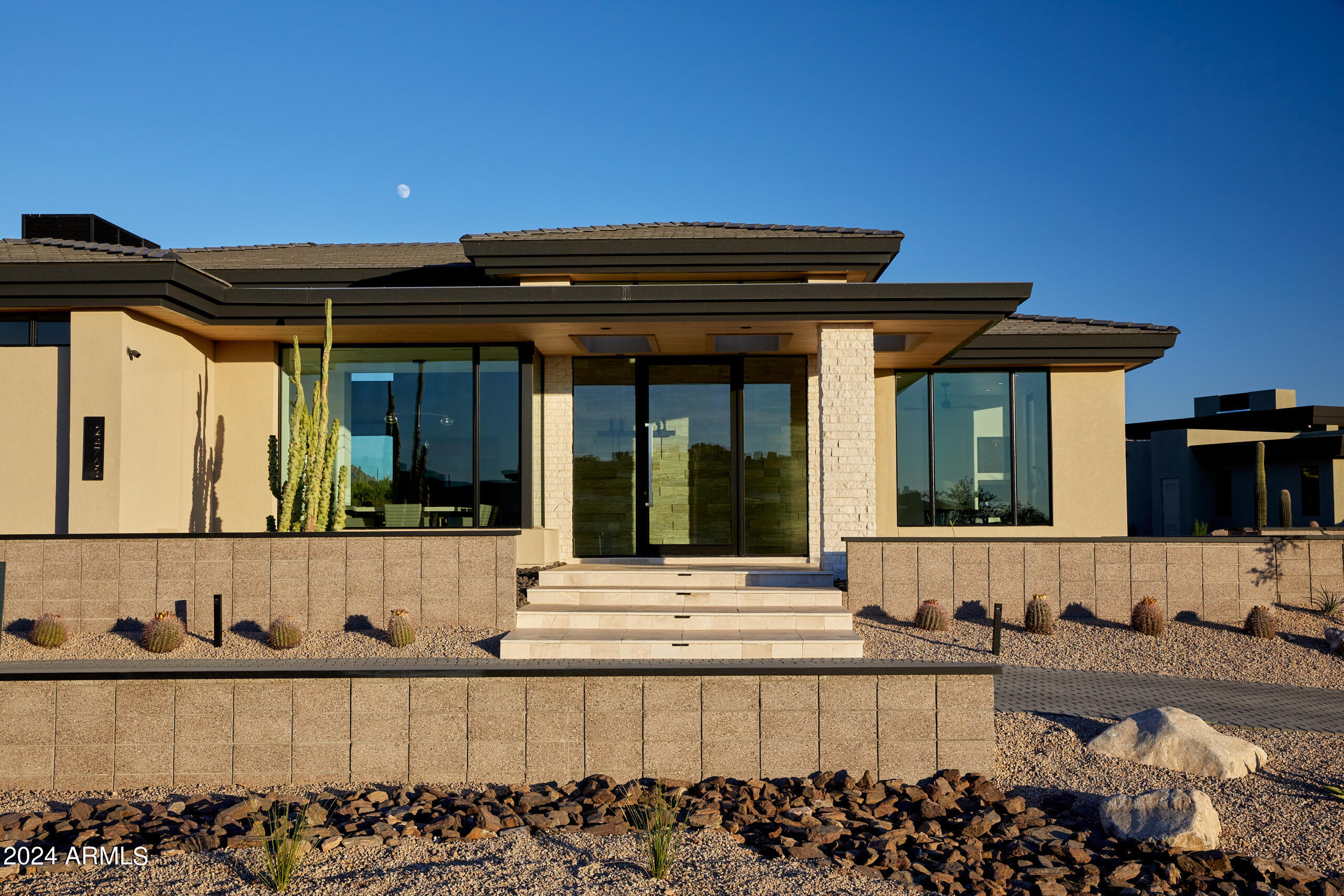 To be completed October 2024, this single level home is one of the most highly upgraded in all of Solitude. With a total of 5,667/sf livable, with 4,686/sf main house and a 981/sf guest house with fireplace, living area and 1 bedroom. The home's Great room includes a 90 degree pocket slider with spectacular views of the McDowell Mountains that opens up to a huge backyard with large lap pool, separate spa, fire pit and room to add a Pickle Ball court. The master suite has great views as well and has an upgraded bathroom design with an extended master closet. The Great room has includes a walk up bar with 2 Sub-Zero wine towers and ice-maker. Swank kitchen with Wolf and Sub-Zero appliances. One of Solitude's most upgraded properties. Photos include photos of like finished model