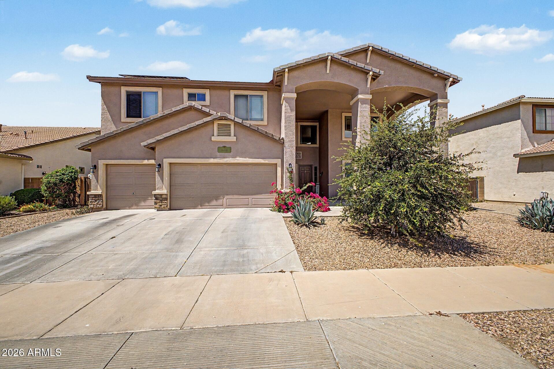 2.25% ASSUMABLE VA LOAN AVAILABLE! Spacious home on an oversized lot with a 3 car garage, RV gate, private pool with removable safety fence, and a flexible floor plan featuring 2 bedrooms and a full bathroom downstairs. The primary suite includes 2 walk in closets, dual sinks, separate tub and shower, and a covered balcony.

The kitchen features a gas stove, center island, and ample cabinet space. Additional highlights include soaring ceilings, a fireplace, upgraded lighting and fixtures, and a huge loft. Outside, enjoy a covered patio, grass area, pavers, and a sparkling pool.

Conveniently located near Loop 303, Costco, Prasada, shopping, dining, and entertainment.