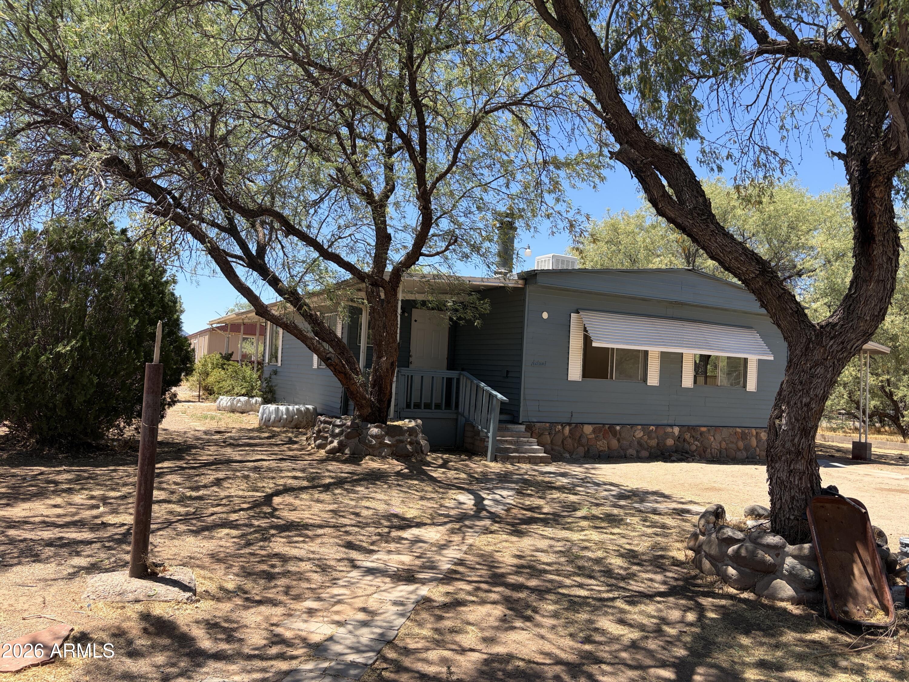 Remodeled 3-bedroom home with a large detached bonus room, perfect for extended family, an extra bedroom, or a hobby space. The spacious 1/3-acre lot is surrounded by trees and shade. Features include a new AC installed in 2022, fresh paint throughout, a cozy fireplace in the living room, and new back porch stairs. Located on a quiet street at the end of the subdivision.