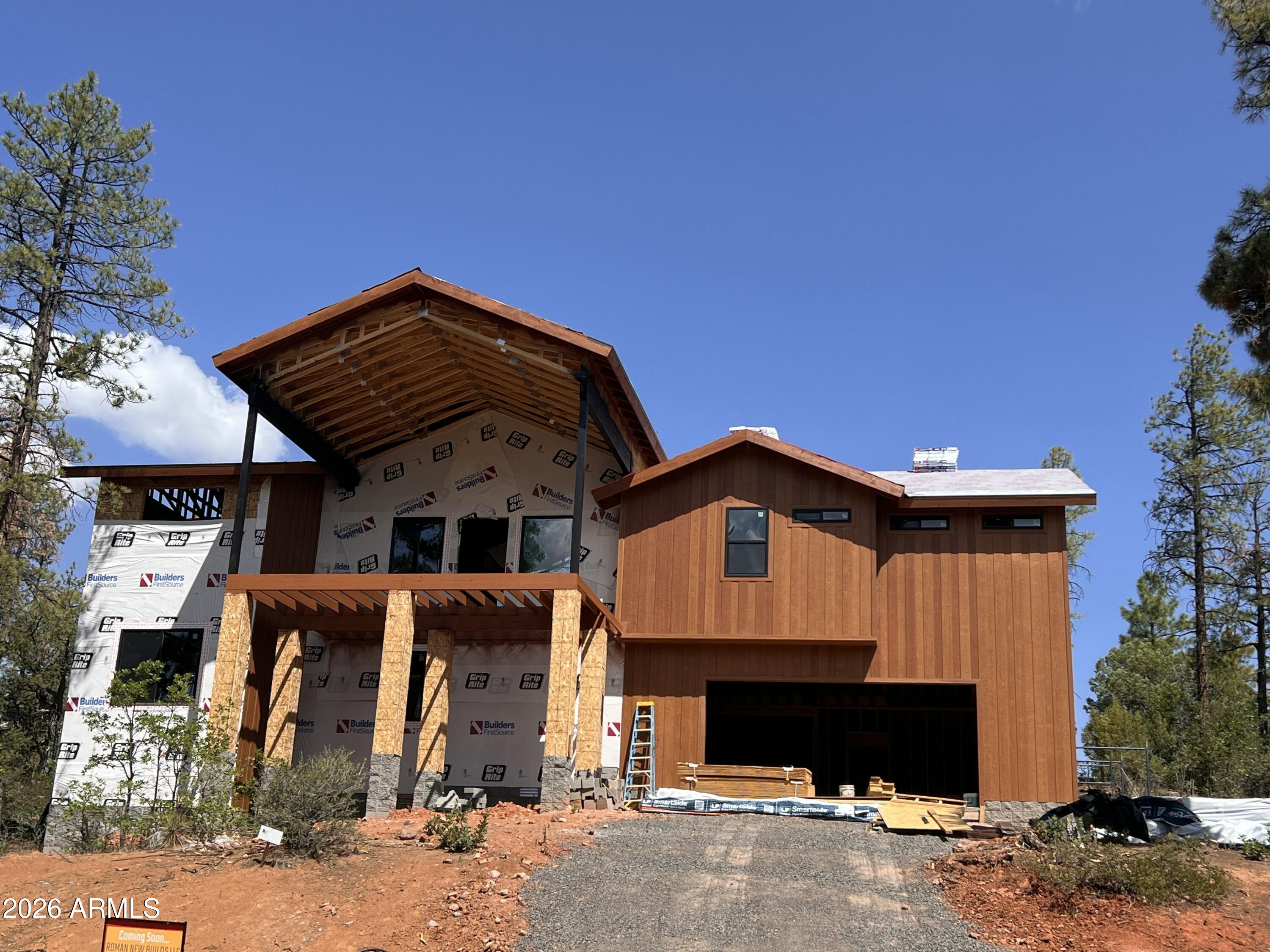 Estimated Completion Fall 2026! There is still time to personalize, select interior finishes and create your dream home. This exceptional new construction mountain retreat in Starlight Ridge Estates offers the charm of a cabin in the pines with the comfort and style of contemporary design.  Located in desirable Lakeside, Arizona, this thoughtfully designed 4-bedroom, including two primary suites, 4-bath home with extended 3-car garage is currently under construction and features soaring vaulted ceilings, expansive windows, and an open-concept floor plan filled with natural light. A dedicated lower-level bedroom and full bath provide added flexibility for guests, a home office, or multi-generational living.  Situated on an elevated premium homesite surrounded by ponderosa pine trees, the property offers privacy, peaceful forest views, and an authentic connection to the natural beauty of Arizona's White Mountains. The inviting interior will feature warm, modern finishes, seamless flow between the kitchen, dining, and living areas, and carefully selected design elements that create a comfortable yet refined mountain living experience.  Whether enjoying quiet mornings among the pines or entertaining family and friends, this home is designed to embrace both everyday living and weekend escapes. Starlight Ridge Estates is known for its peaceful setting and convenient location just minutes from shopping, dining, hiking, fishing, boating, golf, and year-round outdoor recreation.  Ideal as a full-time residence, seasonal getaway, or investment property, this new construction home offers a rare opportunity to own a modern mountain retreat in one of Lakeside's most desirable communities.  **This is an active construction site.  DO NOT Walk Site. Visit can be coordinated with Agent and Builder.**
