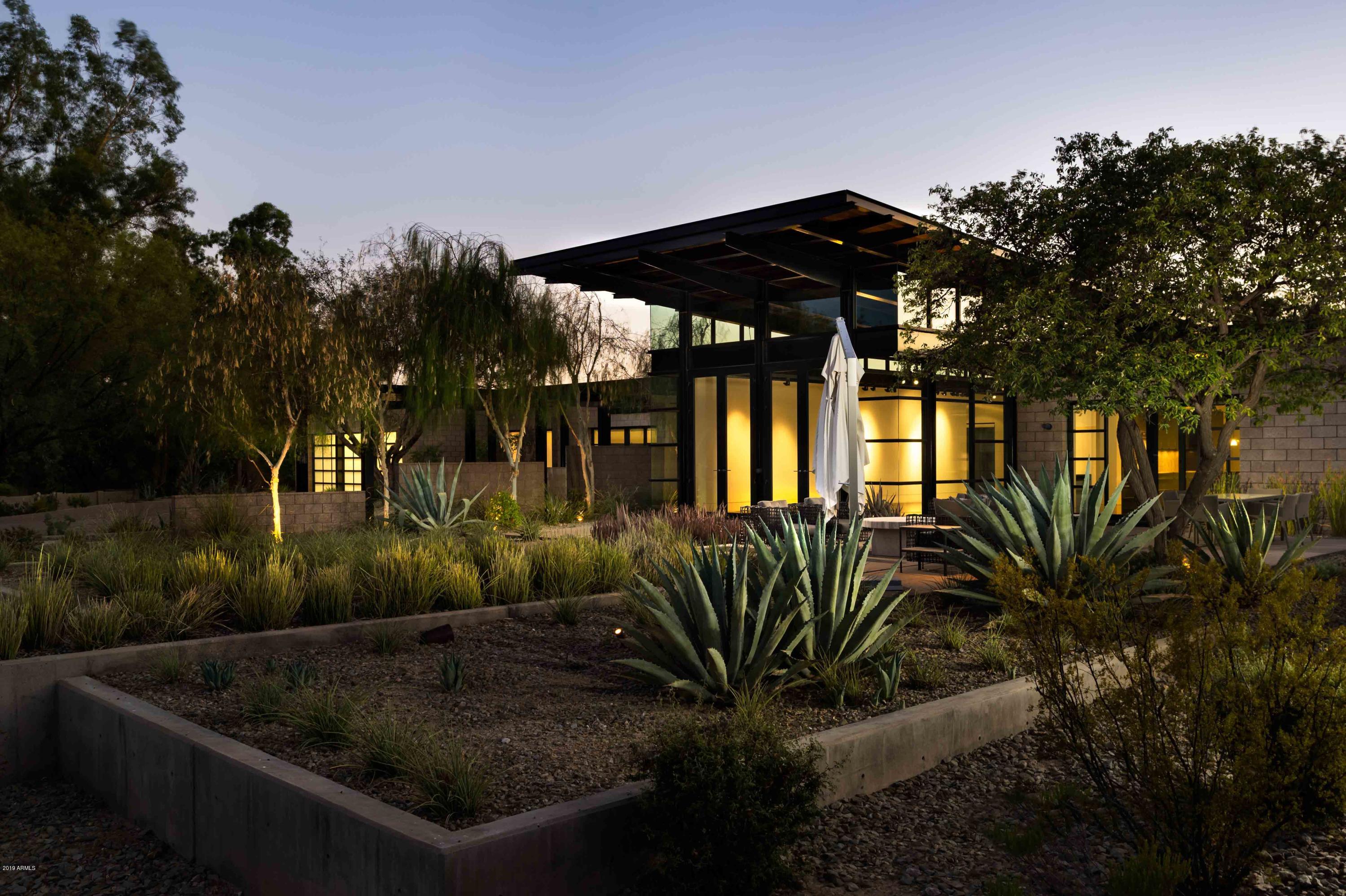 One of the MOST ICONIC Modern Contemporary homes in all of Paradise Valley built by famed Chicago developer William Harris Smith, for his own personal AZ getaway. UNOBSTRUCTED VIEWS OF CAMELBACK MTN. No expense was spared, using massive exposed steel beams and Trenwyth masonry combined with the finest door package from Fleetwood. TRULY THE ULTIMATE ART COLLECTOR'S DREAM - fully adjustable ERCO lighting provides Museum quality exposure. ENTERTAINMENT AT THE HIGHEST LEVEL, massive Chef's Kitchen and separate yet equally impressive Butler's Kitchen both featuring the Rolls Royce of cabinets by Poggenpohl to include Sub-Zero, Miele, Wolf appliances. End of cul-de-sac location and a generous wash behind provide for incredible privacy. Master Suite opens to an inviting 75' x 8' lap... 75' x 8' lap pool. Backyard includes multiple entertaining venues and sitting areas that include a wood burning fireplace, designated outdoor dining area, outdoor kitchen/BBQ directly off the Butler's Kitchen, and a front courtyard with inspiring views Camelback Mountain. 2006 IECC Energy Efficiency Certificate