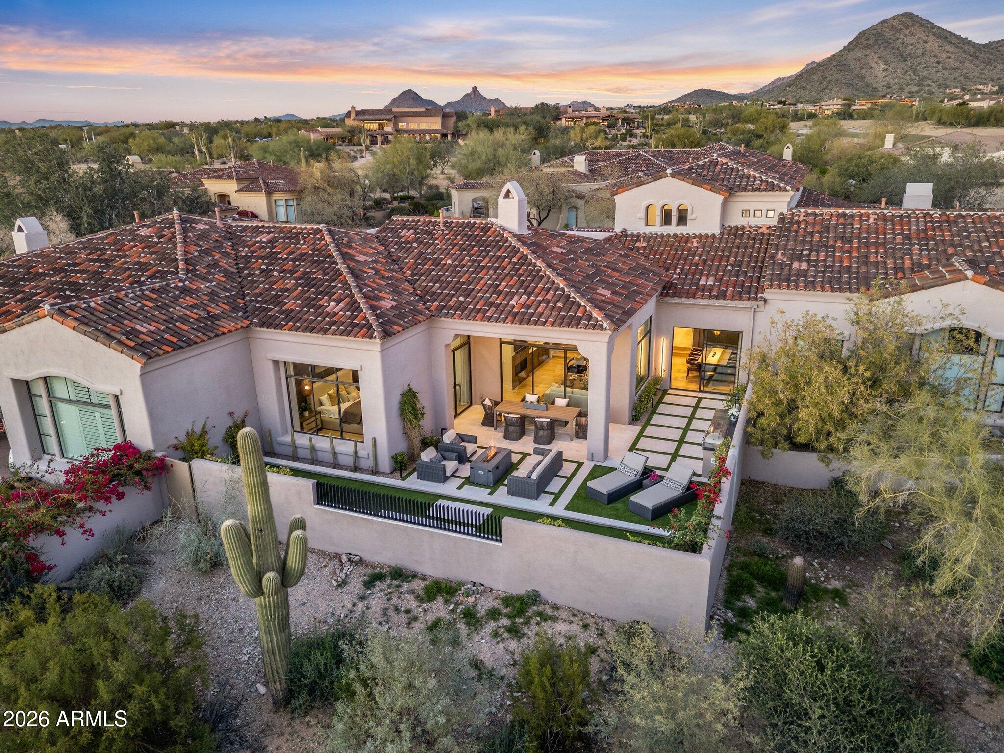 The COUNTRY CLUB AT DC RANCH-Completely reimagined inside and out, this beautifully remodeled residence is tucked within a guard-gated, private enclave. Every detail has been thoughtfully updated with a clean, modern aesthetic that feels both fresh and timeless. Designed for effortless indoor-outdoor living, lock and leave ease and privacy. A short walk to the DC Ranch Country Club or the DC Ranch Community Center, this is refined living in a secure, coveted setting where style, comfort, and lifestyle come together.