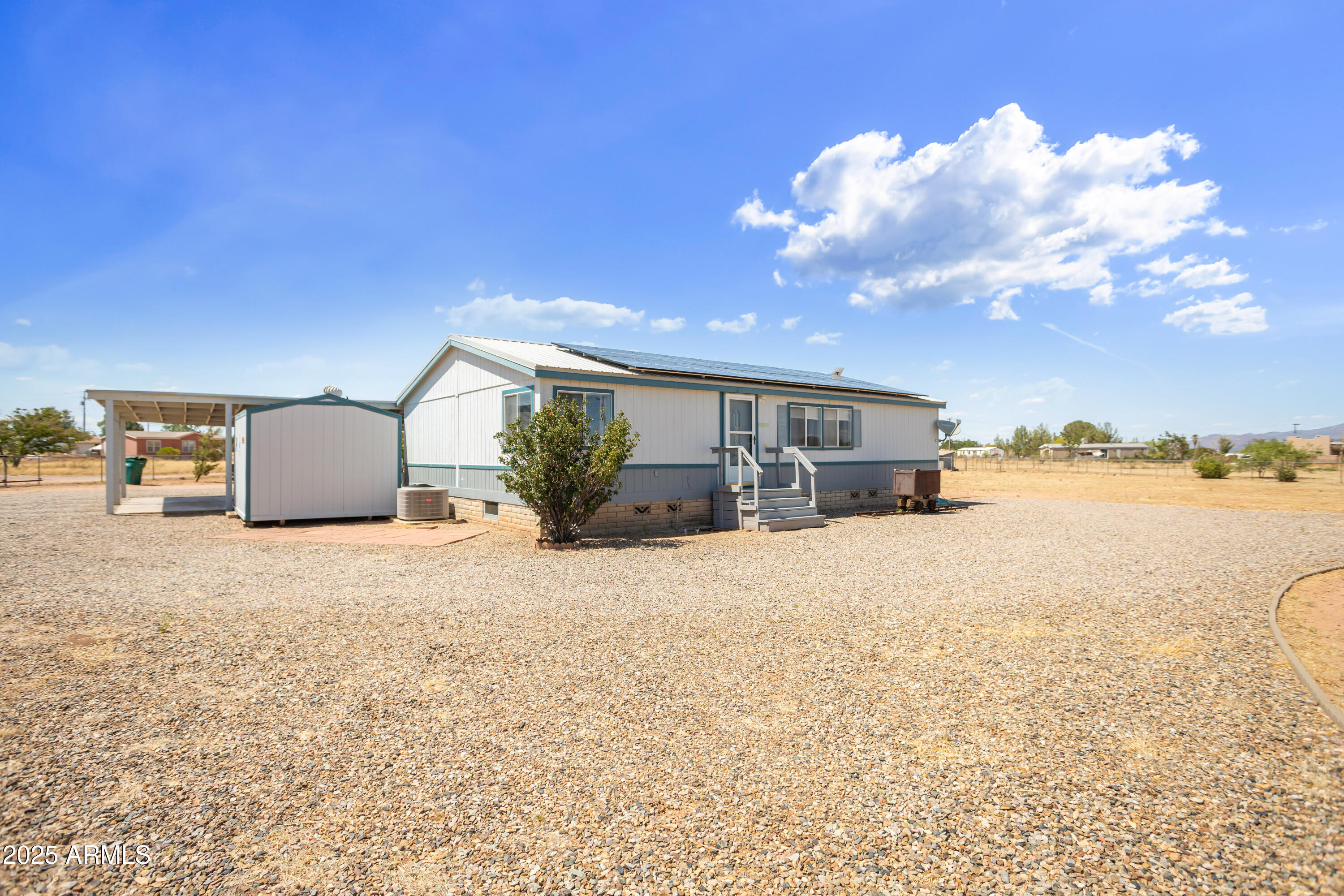 Welcome to 9611 Faith Ave in beautiful Hereford, Arizona! This charming home offers comfort, efficiency, and peaceful living with stunning mountain views. Featuring a spacious layout and a well-maintained interior, the property includes a fully owned propane tank and **solar panels that will be paid off at closing**, providing long-term energy savings and value. Enjoy the freedom of country living with no HOA, all while being just a short drive to town amenities. Don't miss the opportunity to own this energy-efficient home in a serene and scenic setting!