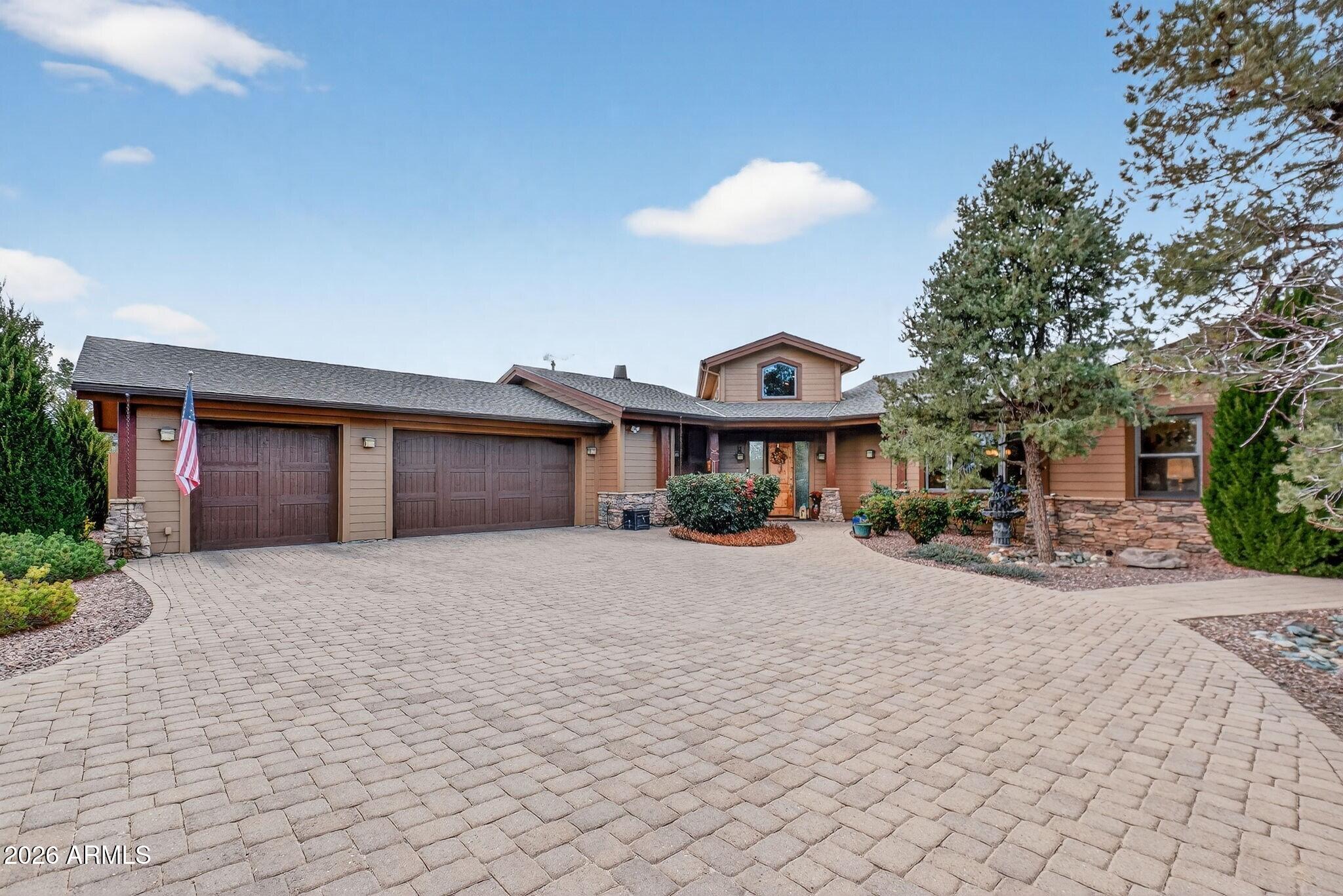 Luxury Single Level Living with Iconic Views in American Ranch! Welcome to 9820 N Clear Fork, where refined living meets true Arizona ranch elegance in the prestigious American Ranch community. Set on 1.06 acres, this 3,400 sq. ft. single level residence offers sweeping Granite Mountain views & an exceptional blend of comfort, space, & style. Inside, vaulted ceilings & a dramatic stone fireplace anchor the light filled living room, framed by a wall of windows that capture the surrounding beauty. The home offers 3+ spacious bedrooms, 3 baths, & an additional 400 sq. ft. flex room—ideal for a home office, studio, or craft space with custom built ins. Designed for both everyday living & entertaining, enjoy time in the inviting family room or step outside to the patio & hot tub. A standout... feature is the separate "cowboy kitchen," complete with a wood burning fireplace, grilling area, & dining spaceperfect for gatherings year-round. Surrounded by manicured landscaping & native plants, this premier equestrian community provides privacy & serenity while remaining close to Prescott amenities. A 3-car attached garage completes the home.  In addition, there is a 10' x 16' site built shed with power & overhead space for seasonal storage, a shop, outdoor equipment... just use your imagination. This home seamlessly blends country comfort with refined luxuryan exceptional opportunity for quiet moments or memorable celebrations. A true must see!