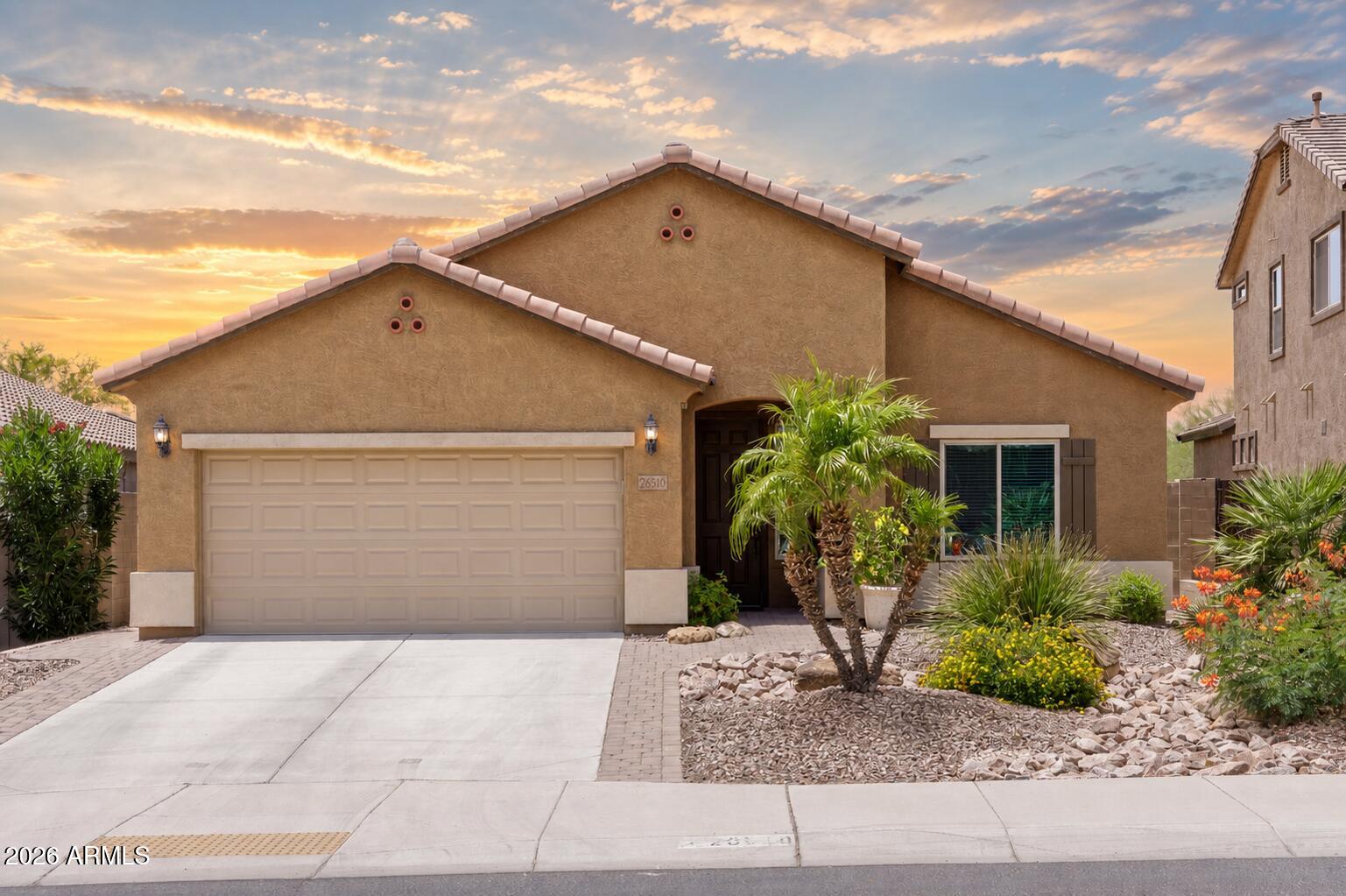 This is the kind of home that feels easy to settle into. Morning coffee on the covered patio, sunset evenings by the pool and spa, and weekend gatherings that flow from the open great room to the private backyard with no homes directly behind. The kitchen is made for connection, with granite counters, gas cooking, stainless appliances, island, breakfast bar, pantry, and eat-in dining. Two flexible den spaces create room to work, unwind, host, exercise, or enjoy hobbies without giving up a guest room. The primary suite offers a backyard exit, walk-in closet, double sinks, and separate tub/shower. With artificial turf, sunken trampoline, laundry sink, soft water loop, wood/tile flooring, and recessed lighting, this home offers comfort, privacy, and relaxed Arizona living. Welcome to a home designed for comfort, flexibility, and relaxed Arizona living. Built in 2015 and offering 2,160 square feet, this 3 bedroom, 2 bath home includes two separate den/office spaces, an open and spacious great room floor plan, and a private backyard setting with beautiful sunset views and no homes directly behind.

The heart of the home is the open kitchen and great room, creating an ideal space for everyday living, weekend entertaining, or gathering with friends. The kitchen features granite counters, stainless steel appliances, a gas stove, staggered cabinetry, pantry, center island, breakfast bar, and dining/eat-in kitchen area. Whether preparing a quiet dinner, hosting guests, or enjoying a casual game-day gathering, the layout offers plenty of room and connection.

The front den provides an excellent office-style space, ideal for working from home, reading, hobbies, or a quiet retreat near the entry. A second den offers additional flexibility and can serve as a media space, guest sitting area, exercise room, creative studio, or separate lounge area while still preserving three full bedrooms.

The primary suite includes a separate exit to the backyard, walk-in closet, executive-height counter with double sinks, and a separate shower and tub. Interior features include wood and tile flooring, recessed can lighting throughout, two-tone paint, double-panel colonial interior doors, and a separate laundry room with sink.

The backyard is the true highlight of the home. With a pool, spa, sunken trampoline, artificial grass, covered patio, and open sunset views, it feels like a private retreat. It is a space made for morning coffee, a quiet evening beverage, relaxing after the day, or entertaining friends on a Saturday night. The low-maintenance landscaping allows you to enjoy the setting without spending your weekends maintaining it.

Additional features include an paver side extensions along the driveway, insulated two-car garage with separate exit to the rear yard, and soft water loop. This home offers a strong combination of privacy, function, flexibility, and indoor-outdoor living in a desirable Peoria location.