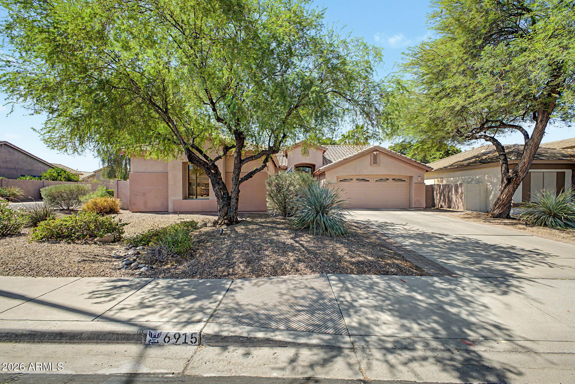 Owner/Agent - BEAUTIFULLY MAINTAINED SINGLE-STORY home on a NORTH-FACING CORNER LOT with BREATHTAKING MOUNTAIN VIEWS! Offering 2,384 SqFt, this 4-BEDROOM, 2-BATH home features a SHADED DRIVEWAY and 3-CAR GARAGE with OVERHEAD STORAGE. Inside, enjoy BRIGHT & AIRY living spaces including a FORMAL LIVING/DINING ROOM, spacious FAMILY ROOM, and SUNNY DINETTE AREA with EXPANSIVE SLIDING GLASS DOORS. Pre-wired SURROUND SOUND makes it PERFECT FOR ENTERTAINING! The STUNNING KITCHEN includes a NEW DOUBLE-OPEN PICTURE WINDOW, CENTER ISLAND, BREAKFAST BAR, GRANITE COUNTERS, 42'' CABINETRY, BUILT-IN WATER FILTRATION, and NEWER STAINLESS STEEL APPLIANCES. The extra-large primary suite boasts a bathroom w/spa shower! Both bathrooms have double sinks. Tile flooring runs throughout the home, w/newer wood flooring in secondary bedrooms. Private backyard oasis showcases tropical landscaping, a fenced play pool, retractable awning w/lighting, covered patio w/shades, 2 outdoor water features (a waterfall w/new pump), & low-maintenance pavers. NO 2-story homes behind or beside provide exceptional privacy! Additional upgrades include newer air conditioners, extra attic insulation, solar attic fans, newer landscape watering & lighting systems, forever house lights installed on the eaves, a newer gas water heater, water softener, Ring security system w/security front door, high-speed internet available, gas heat, gas connections for stove & dryer, & a gated dog run w/dog door. This exceptional residence awaits you. Hurry!