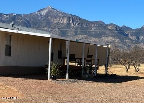 PERFECT WINTER HOME WITH MOUNTAIN VIEWS! Located on a prime corner, 4 acre parcel. Bring your horses, family and friends! This lot is completely fenced with paved roads on both sides, RV gate, 2 FULL RV hookups, 2 Large Storage Sheds, Central A/C, Carport and Majestic Mountain Views! Plenty of room to spread out! This would make a nice starter home or the perfect seasonal home for a lucky buyer! Plus, a PRIVATE WELL! This 1 bedroom/1 bathroom remodeled home is MOVE-IN ready and completely Furnished with Newer appliances including washer, dryer and refrigerator. Enjoy your morning brew and mountain views on the beautiful front deck or enjoy a game of horseshoes with your friends out back. Whatever you choose, call for a tour to view this home today!
