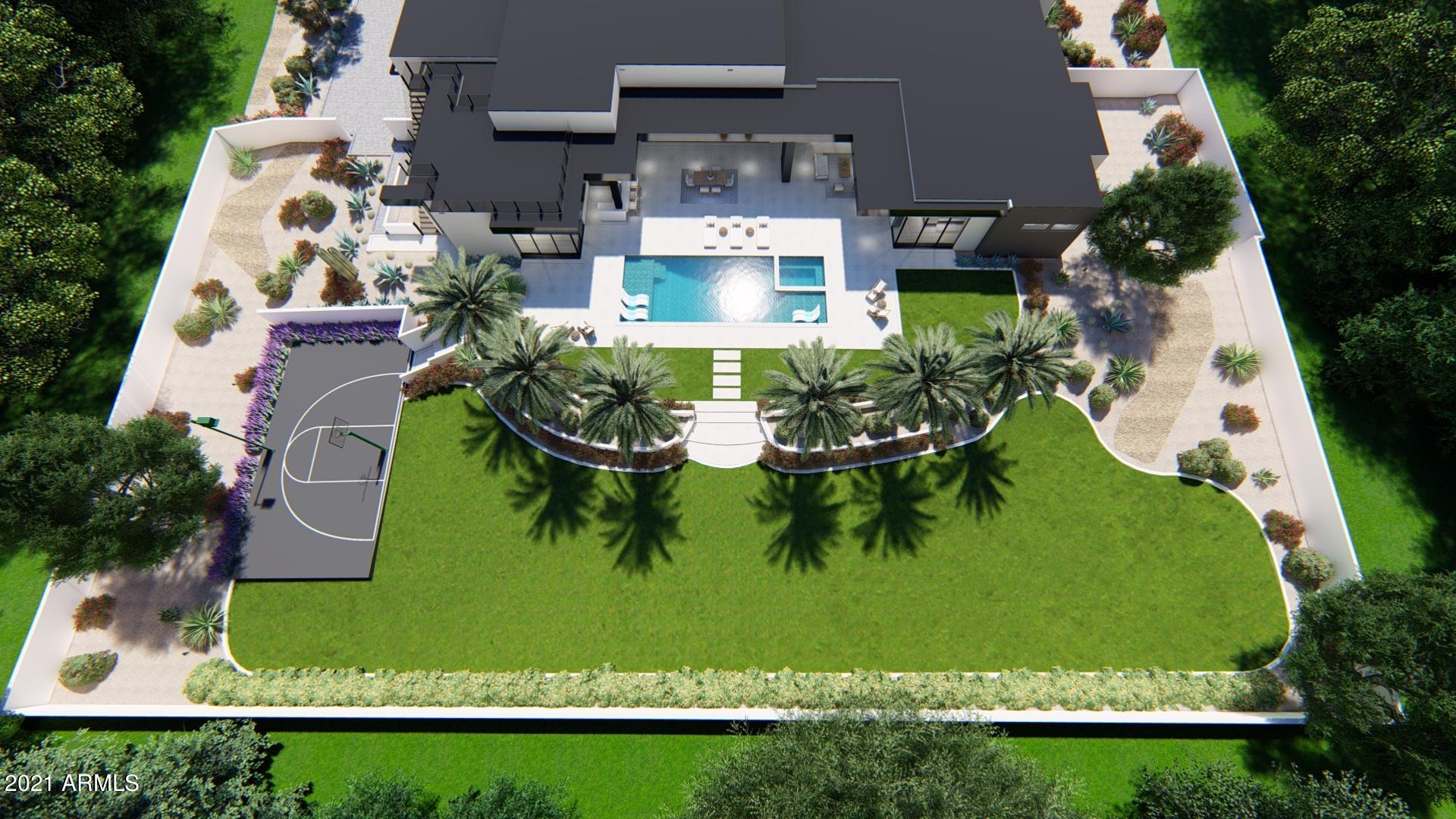 This beautiful 2021 Yonker Construction modern contemporary new build offers great indoor-outdoor living, a generous open concept floor plan made for entertaining, a stunning resort style backyard with pool and spa, outdoor kitchen and sports court. The oversized master suite in this split floor plan has private direct access to pool and spa through its huge sliding pocket doors, as well as a luxurious master bathroom with his and hers vanities, free-standing tub and an oversized walk-in shower. The great room with its 16' ceilings with a generous dining area and the chefs kitchen that offers tons of seating around the double islands and features views of the linear fireplace, separate glass wine room, and the pool area. Beautiful mountain and city views can be enjoyed from the roof top