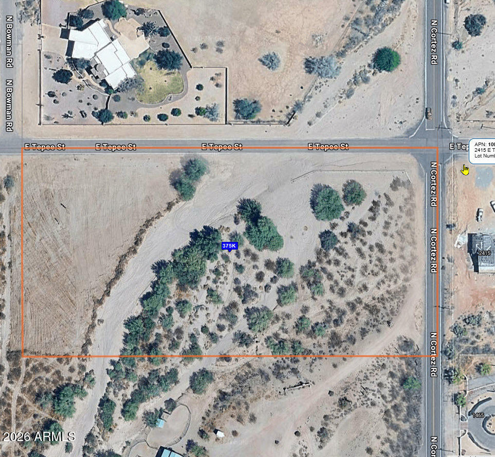 5 Acre parcel located in an area of custom homes with horse privileges. The lot could possibly be split through the City of Apache Junction to allow more than one residence to be built on the property. Great views of the Superstition Mountains. The property does have a wash that runs through a portion of it that might limit some of its use.