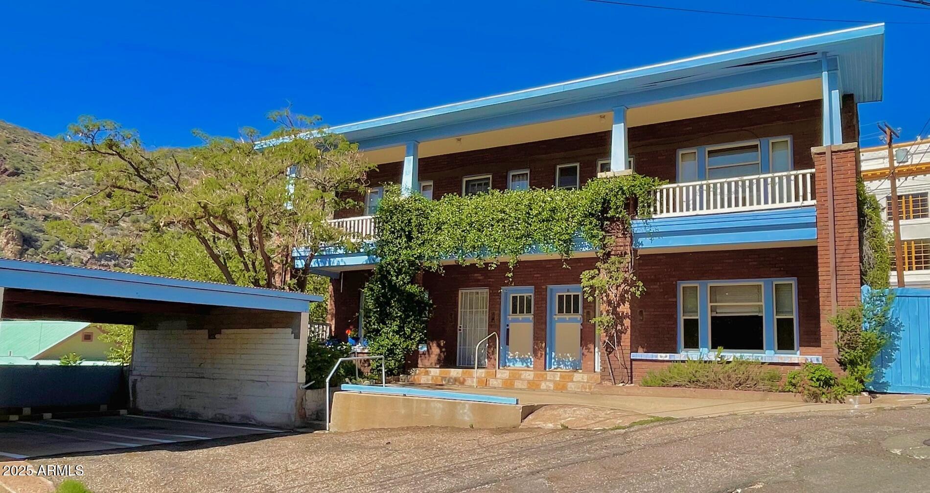 Beautiful, substantial, well-built and spacious 3-unit brick building in the heart of Old Bisbee, in very good condition, oozing with character and filled with original features and charm. This building could easily be renovated back to the original 4-unit layout. Interior features include maple floors, original windows, high ceilings, light-filled Arizona rooms, and wood detailing to include original built-ins. Outside you?ll find private parking for 3 cars, captivating views from balconies and a secluded, fully landscaped tranquil garden oasis. Property currently consists of two 1-bdrm apts and one 2-bdrm apt, and a very large, full-height finished basement ready for storage, studios, workshops, whatever! All units are individually metered for electric. Buyer to verify all facts/figures