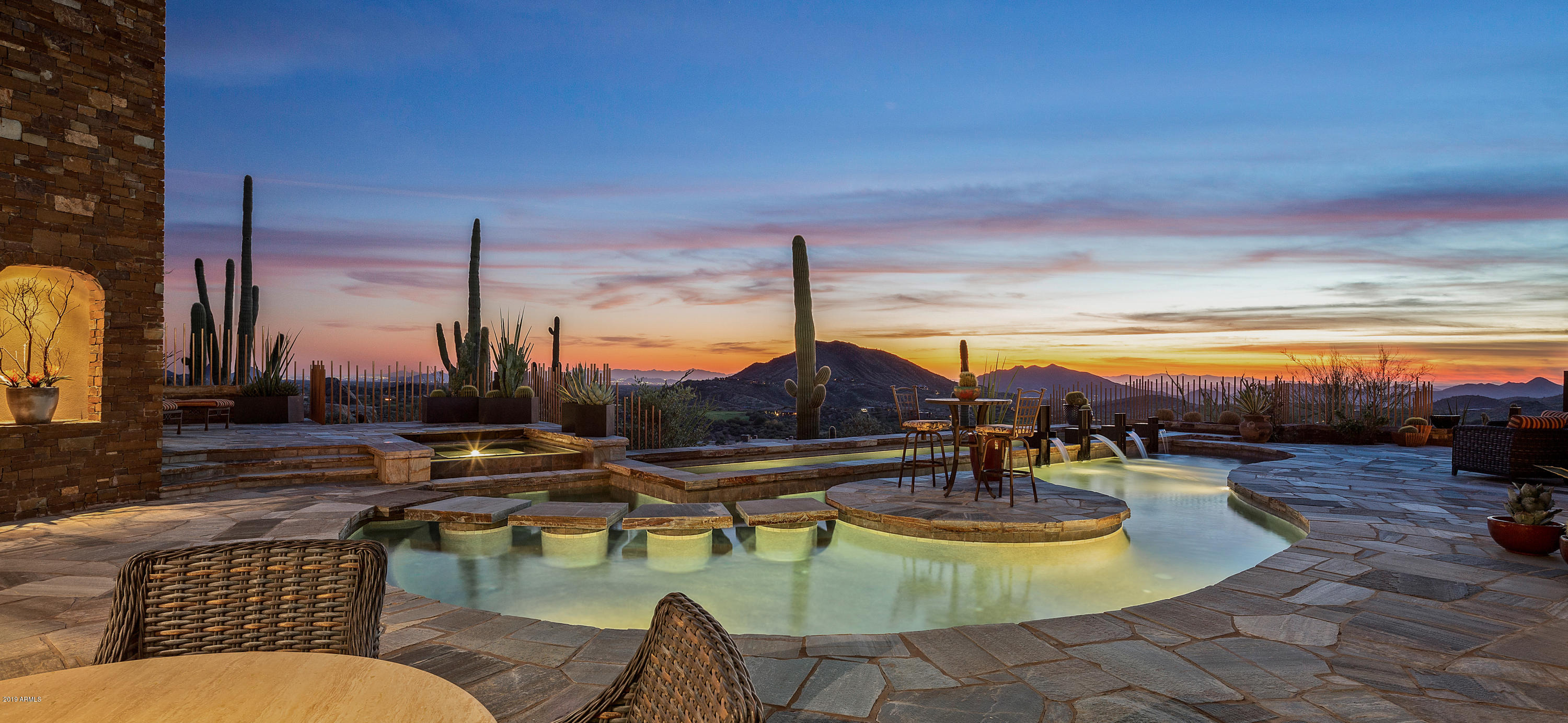 Most photographed home in recent times at DesertMountain! Spectacular, timeless, refreshed, Desert Contemporary Terry Kilbane design.  The lush courtyard with water feature presents a dramatic sense of arrival. Upon entry, the stunning panoramic view of the Valley in all its splendor unfolds. Built on one of the premium and private view lots in Desert Mountain, this home offers unobstructed views of city lights, mountains, sunsets, and multiple golf courses. The home wraps around two pools and a sensational outdoor entertaining area. The open, single level plan is appointed with timeless, sophisticated finishes. The guest house is spacious and has its own private patio. Easy walk to the Club house, dog park and driving range.View ''Documents Tab'' for location within Community and Village.