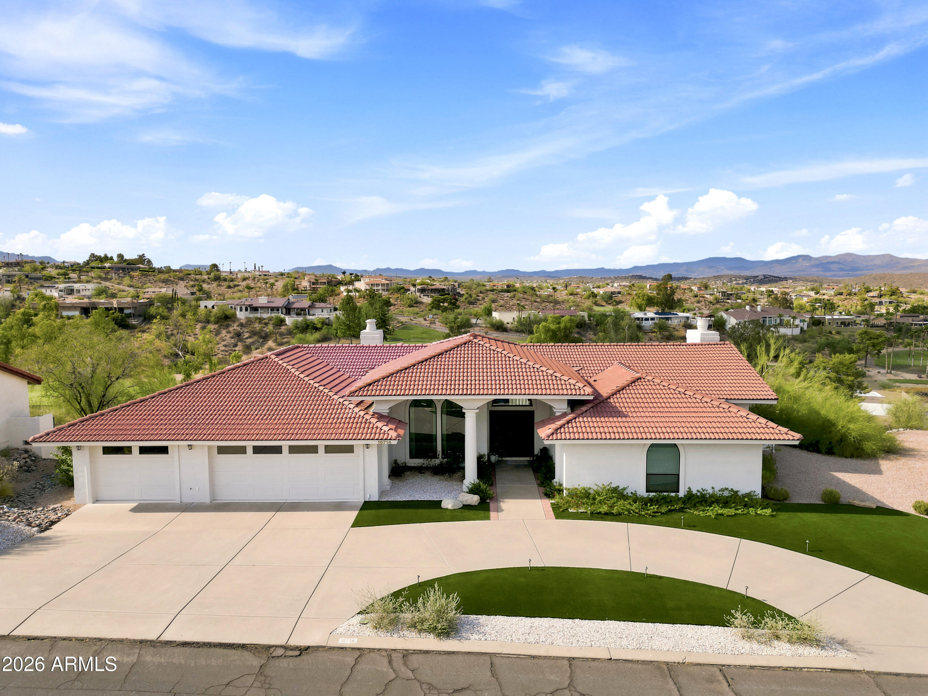 This home PRESENTS BEAUTIFULLY with LUXURY UPGRADES and a DESERT CANYON GOLF COURSE FRONTAGE.  The home is Positioned directly on the Desert Canyon Golf Course with sweeping Four Peaks and McDowell mountain range views along with splendid multiple fairway views.  This fully re-imagined 4-bedroom, 3.5-bath residence delivers the turnkey luxury lifestyle without compromise.  From the moment you arrive, the home makes an impression. A graceful arced concrete driveway is flanked by premium artificial turf, lighting, and curated white river rock landscaping, creating resort-caliber curb appeal that sets this home apart from the moment of arrival.  Inside, every surface has been thoughtfully elevated. Luxury engineering wood flooring flows throughout the entire home. The master suite is a true sanctuary. Redesigned from the ground up with a freestanding soaking tub, a fully re-imagined walk-in closet, and a spa-inspired bath that rivals the finest new construction. All other bathrooms have been remodeled to current luxury standards.  The kitchen features a modern expanded sink design with upgraded fixtures, a under counter ice maker, and double electric wall ovens, complemented by Marble Taj Mahal countertops and quality finishes throughout. A covered patio and sparkling in-ground pool complete the outdoor living experience, all framed by unobstructed golf, Fountain Hills fountain fixture, and mountain views that never age.  Additional highlights that matter, these amenities have all been upgraded within the last two years:   Energy-efficient installed Anlin windows throughout, EV charging station in the 3-car garage with premium polyurethane-coated flooring, Whole-home water softening system, Pool water heater, motor and pool pump, Hot water heater, Reverse Osmosis, Freshly painted interior and Exterior, and new light fixtures and ceiling fans throughout the home.  This is a rare opportunity to acquire a turnkey, move-in-ready golf course home in one of Fountain Hills most coveted settings a place where every detail has already been done, and done in a sophisticated manner!
