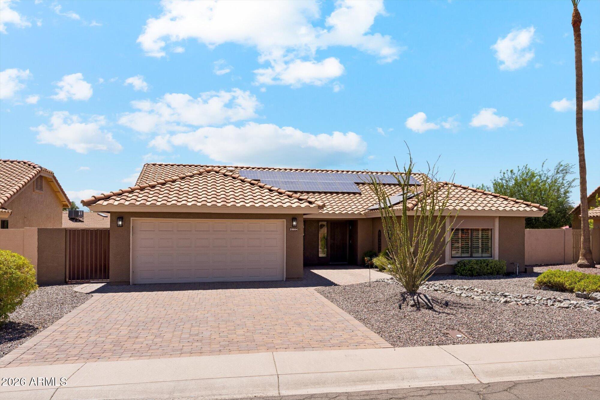 Turnkey 2-bedroom, 2-bath home in a sought-after 55+ community, appraised at $520,000 in March 2025. The open-concept floor plan features vaulted ceilings with decorative beams, abundant natural light, plantation shutters, and an updated kitchen with quartz countertops, tile backsplash, soft-close cherry cabinetry with pullouts, and a wine captain. The spacious primary suite offers a jetted tub, separate shower, dual sinks, and walk-in closet. A secondary ensuite bedroom also includes a walk-in closet. Leased solar helps enhance energy efficiency. Enjoy outdoor living in the screened lanai overlooking lush landscaping, fruit trees, and raised garden beds. Community amenities include two 18-hole golf courses, fitness center, pickleball, community centers, and 80+ clubs. Convenient to shoppi