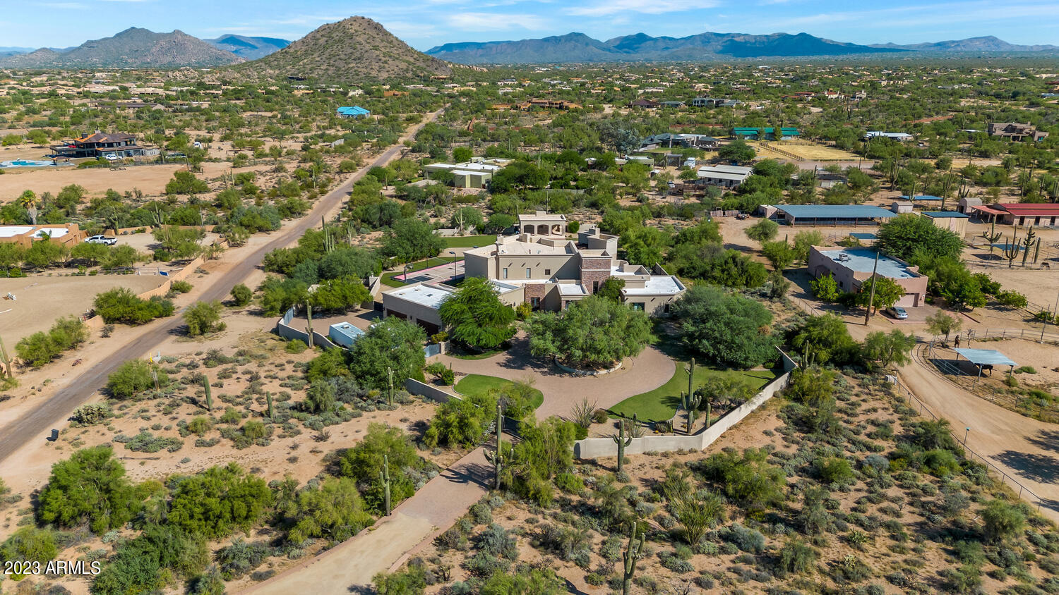 Come see this amazing compound, on  almost 5 acres in the middle of the Scottsdale.  Sprawling gated private estate boasting a full size basketball and volleyball court, a gigantic heated pool and spa, true chefs kitchen with Thermador appliances, custom movie theater complete with fiber optic led lighted room.  You truly have to come see this one of a kind amazing estate for yourself.  Your out in the country on your own 4.5 acre gated compound but your close to amazing dining and shopping.  Drive thru your motorized gates to your new private estate boasting 6 car garage for all the toys. Property also has its own back up generator if the power goes out.   Buyer to verify all information.