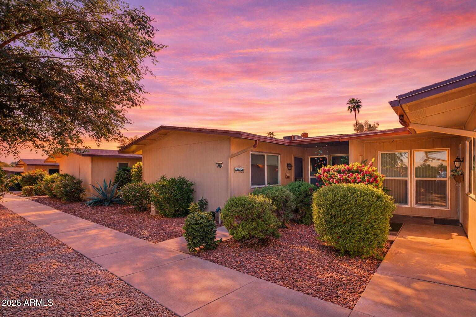 Discover your dream garden apartment in the heart of Sun City West, AZ! This rare 2BD/1BA home offers 1,341 sq ft of living space, including a 195 sq ft expansion perfect for an office or hobby room. Recent modernizations include popcorn ceiling removal, new flooring, and a beautifully remodeled shower. Enjoy energy efficiency with upgraded windows and a newer HVAC system (2021). The HOA recently replaced the roof, providing peace of mind. The kitchen remains largely original, enhanced by a custom breakfast counter. Just moments from rec centers, golf courses, shopping, and dining, this home is an ideal choice in a vibrant 55+ community.