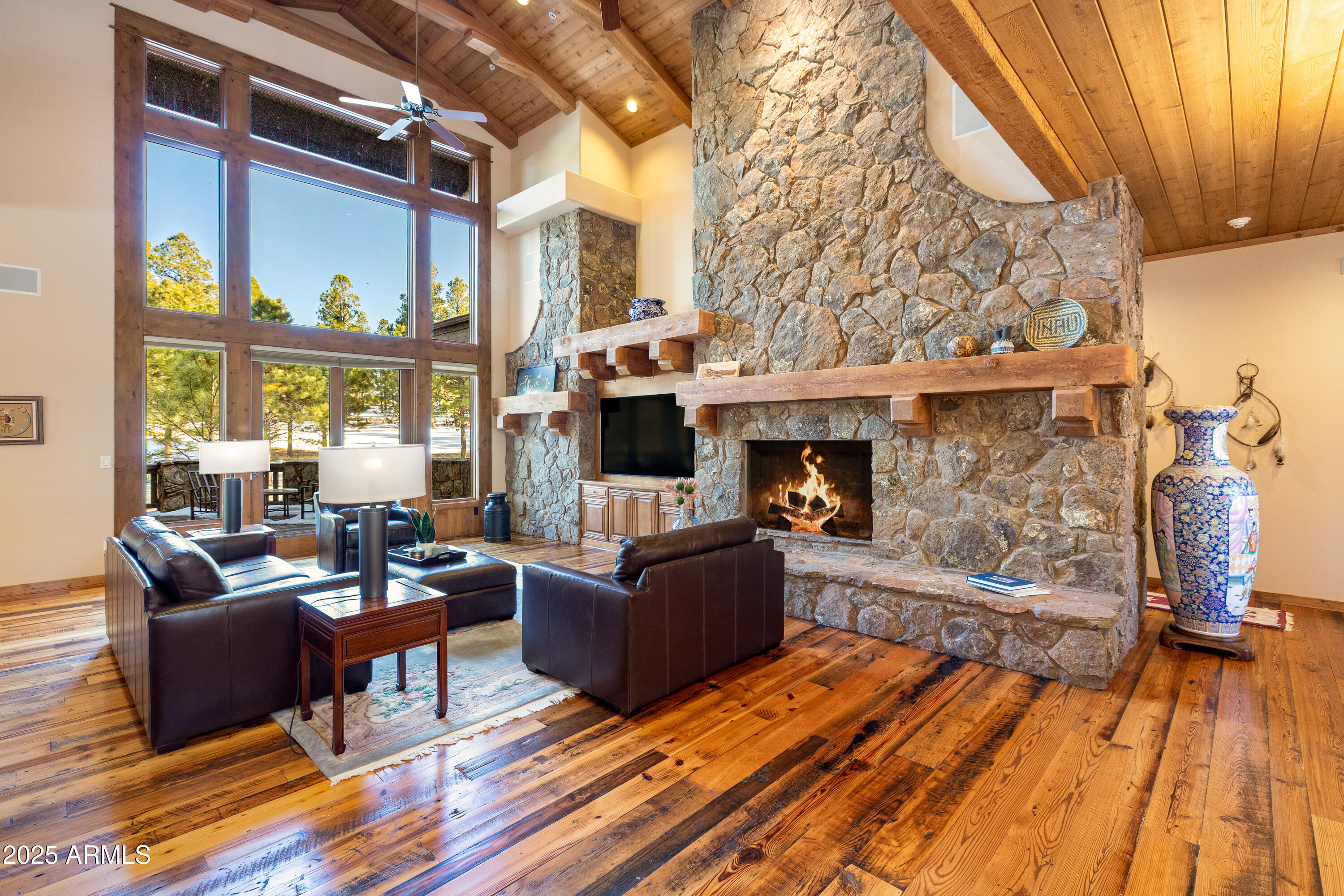 Escape to your Mountain Haven, where warmth, charm, and luxury come together in perfect harmony. Nestled on the golf course in Pine Canyon, this home invites you to unwind in nature while enjoying modern comforts. The expansive 1,200 sqft .wrap-around deck is the perfect spot to relax, whether you're soaking in the mountain air alone or hosting friends and family. Complete with a grill center and a cozy fireplace, it's designed for both day and night enjoyment.
Step inside to a kitchen that's a true centerpiece, featuring high-end SubZero and Wolf appliances, beautiful wood cabinetry, and natural stone countertops. Open to the dining and family rooms, it's the ideal space for gathering and flows seamlessly to the outdoor deck, where you can savor mountain views. With wood ceilings, massive beams, Malpais stone accents, and reclaimed barn wood floors, the home feels deeply connected to the surrounding landscape. The living room, anchored by a grand Malpais stone wall and gas fireplace, is perfect for those quiet mountain evenings, watching the snow fall through floor-to-ceiling windows.
The main-level primary suite is a true retreat, complete with its own fireplace, direct access to the deck, and a spacious en suite bath with a jetted tub and separate shower. Another bedroom on the main floor offers a beamed ceiling and can easily transform into an office or reading room.
Upstairs, two more generous suites and an open loft area provide plenty of space for family and guests, with one suite offering its own private balcony overlooking the golf course.
With a three-car garage featuring a Level 2 charger for your electric vehicle, and a serene lot spanning .85 acres that overlooks the 5th and 7th fairways and greens, this home offers the ultimate mountain escape. With a heated drive and central vacuum you can plan on spending more time having fun! Pine Canyon offers the flexibility of no membership requirement, while two levels of membership are available for those interested.
Whether you're seeking a peaceful getaway or a place to host family and friends, this home offers the perfect blend of seclusion, luxury, and natural beauty. The seller may also be open to a leaseback, with some furnishings negotiable. Don't miss the opportunity to own this mountain retreat!