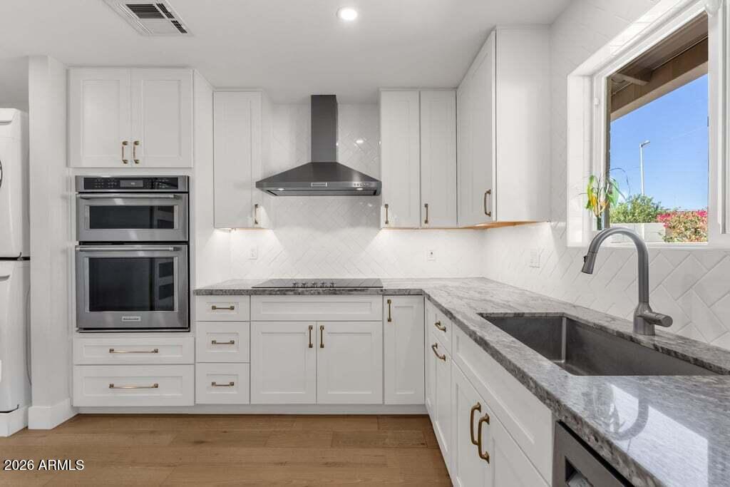 Beautifully remodeled Mid-Century home on a quiet interior lot in the highly desirable South Scottsdale Corridor, just minutes from Old Town Scottsdale, Fashion Square, Chaparral Park, restaurants, and Loop 101. This 3-bedroom, 2-bath home features an open floor plan, a remodeled kitchen with white cabinetry and granite countertops, updated bathrooms, new flooring, an enclosed garage, and a complete plumbing and sewer line replacement. The private backyard is perfect for entertaining with new pavers, a pergola, putting green, fresh gravel landscaping, and mature trees. Combining modern updates with timeless charm and no HOA, this move-in ready home is a must-see!