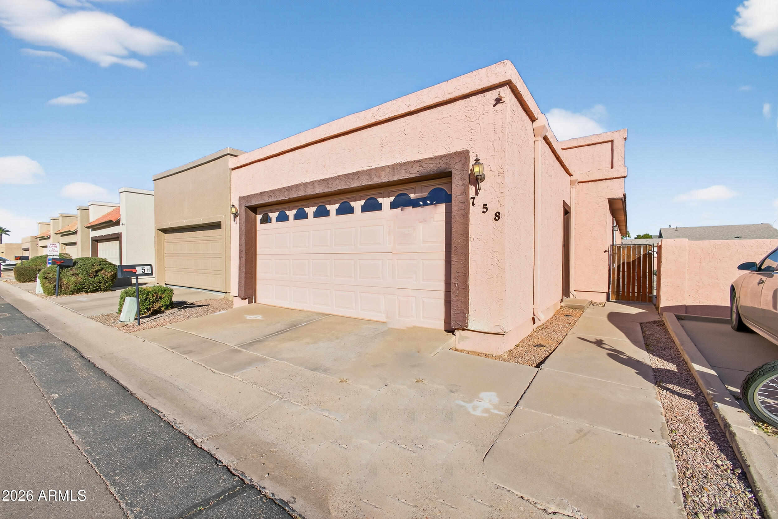 This well-maintained townhome offers a bright and welcoming atmosphere throughout. The spacious kitchen opens seamlessly to the dining and living areas, enhanced by vaulted ceilings that create an open, airy feel. The primary suite features a walk-in closet, and the home includes indoor laundry with a washer and dryer. Enjoy low-maintenance desert landscaping and access to the community pool without the hassle of upkeep. The HOA covers water for added convenience. Additional upgrades include a new AC unit, new furnace, and paid-off solar. This charming townhome is a must-see!