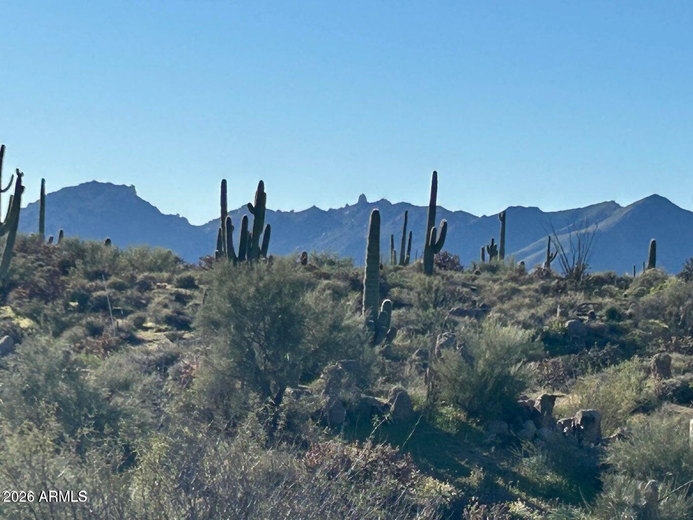 1.84 Acre lot in Troon North's Desert Crest gated community.  There are plans in process for a 5,237 sf contemporary home designed by Luxor Homes.  Home sits on top of lot and has exceptional 360-degree views.  Home with high-end finishes, site prep, pool as shown on site plan and landscaping, built by Luxor Homes, is approximately $3,500,000 more.