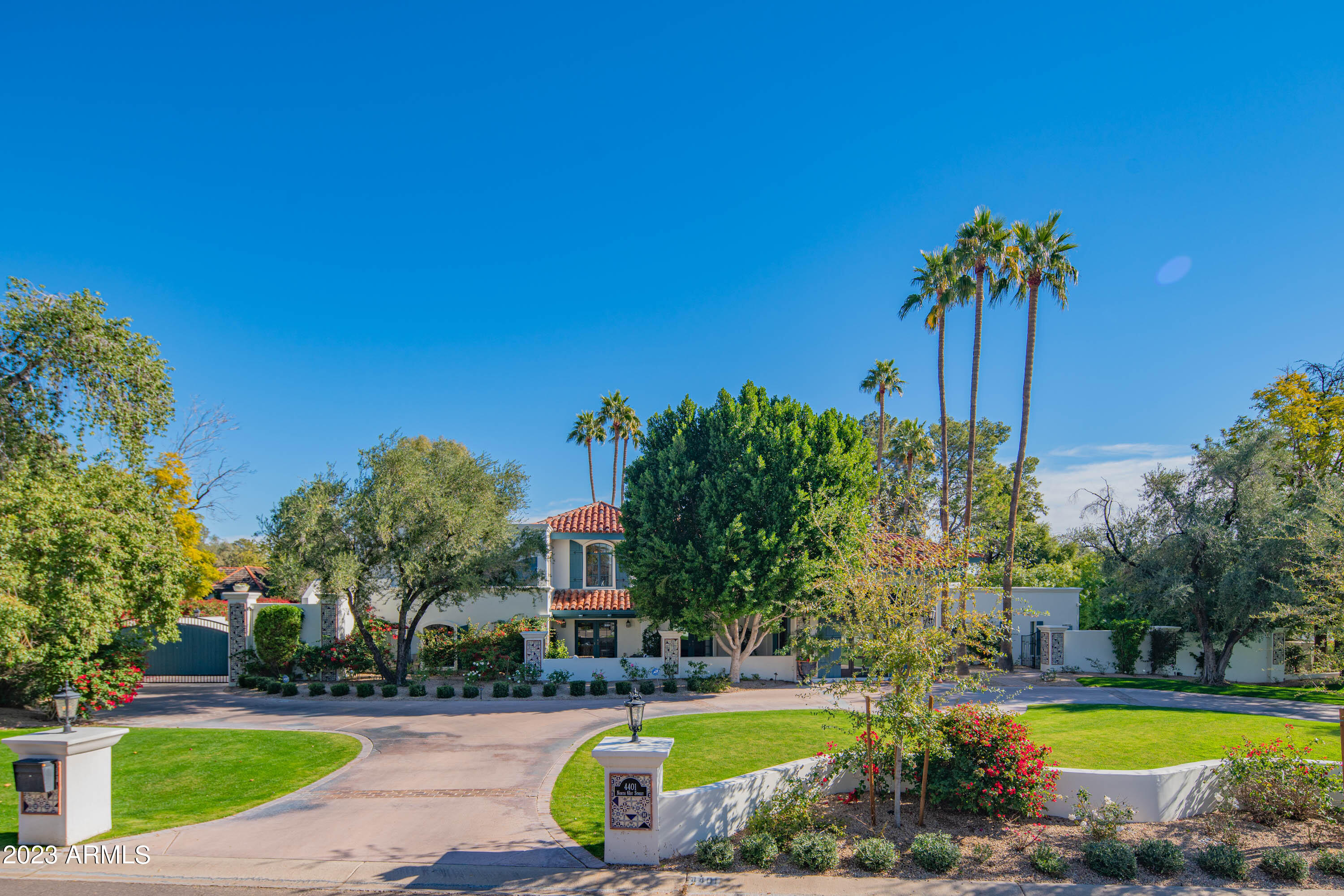 Nestled on a private, one-acre lot in the coveted Arcadia neighborhood is a one-of-a-kind, truly beautiful Spanish style estate with stunning Camelback Mountain views. 
The property has been transformed by the current owners and consists of a 7611 sq ft main residence that oozes style and charm. It has a Stunning Entry and Foyer, and from there, each Generous Living space flows seamlessly together. Highlights include: Formal Dining Room with Private Patio, Open Concept between the Family Room and a Gourmet Chef's Kitchen with Walk in Butler's Pantry and Wine Fridge, Three spacious Guest bedrooms, all with En-Suite, and a Romantic Primary Bedroom Suite that has it all, including a Fireplace, a Gorgeous Bathroom, with Private Patio and His and Her Closets. There's also an upstairs apartment with kitchen and separate access from the within the gated motor court  ideal for company.
Then you step into the Resort Style Backyard and it's Picture Perfect! A Heated Pool and Spa with Outdoor Shower and bathroom, Huge Putting Green, Kids Play Area, Fire Pit and an Outdoor Kitchen that has Chef Quality BBQs, Smokers, Grills, Pizza Oven and Seating at the Bar for 12 people.
Completing the picture is the beautifully Designed / Built 1343 sq ft Two Bedroom Guest House.
All surrounded by Mature Landscape, Shade Trees, Fruit Trees and Lush lawn.
It's more than an Estate...it's a Home that you'll simply never want to leave.