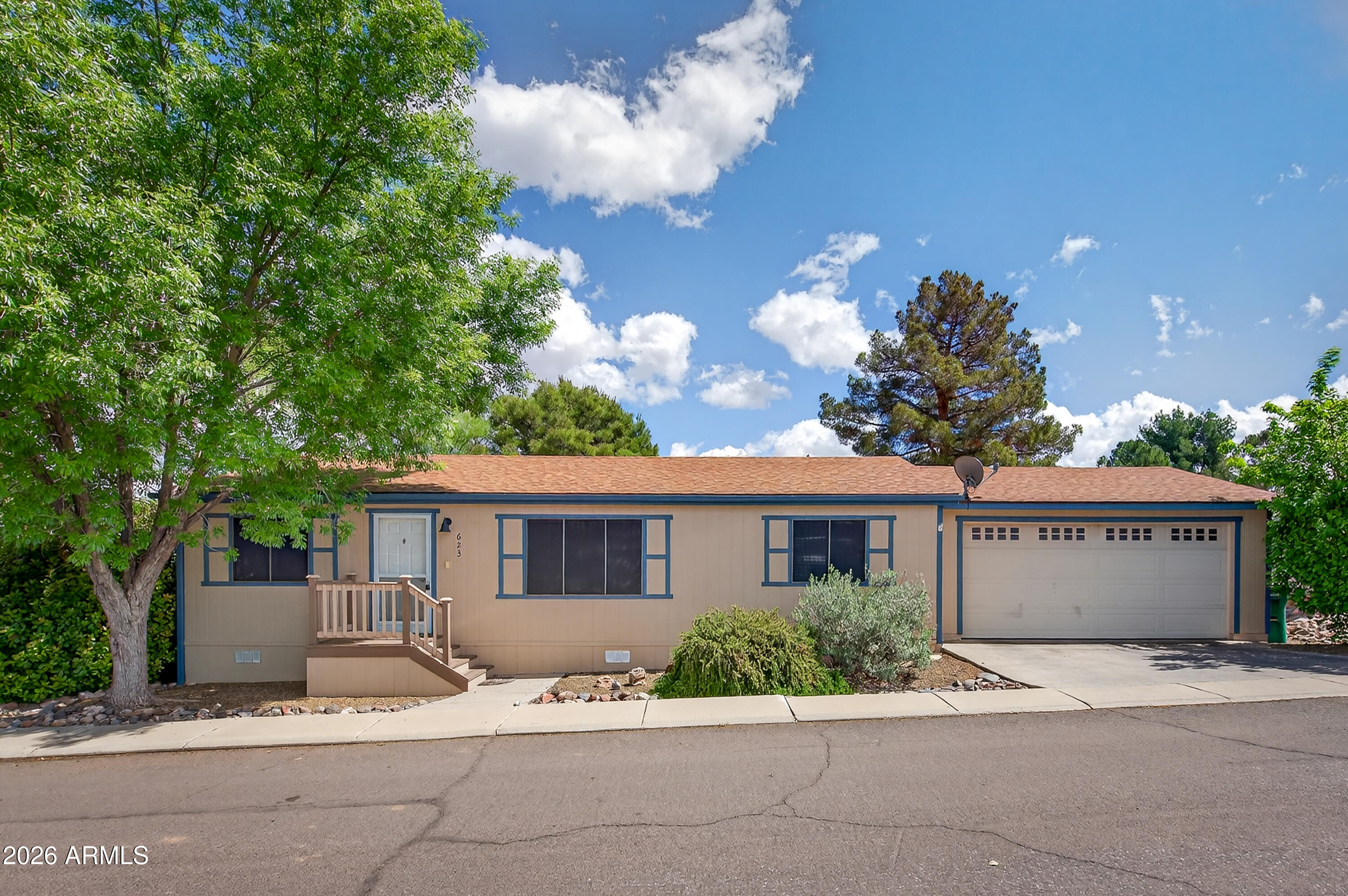 Welcome home to this charming manufactured home located in a desirable, amenity-close neighborhood with no age restrictions! This light-filled residence features an open-concept main living area, creating an inviting space perfect for both relaxing and entertaining. The spacious primary suite offers a large walk-in closet, providing plenty of storage. Step outside to enjoy the fenced backyard and deck--ideal for outdoor gatherings, pets, or quiet mornings. A two-car garage adds convenience and additional storage. With affordable leased land at just $500 per month, this home offers comfort, functionality, and value in a great location.