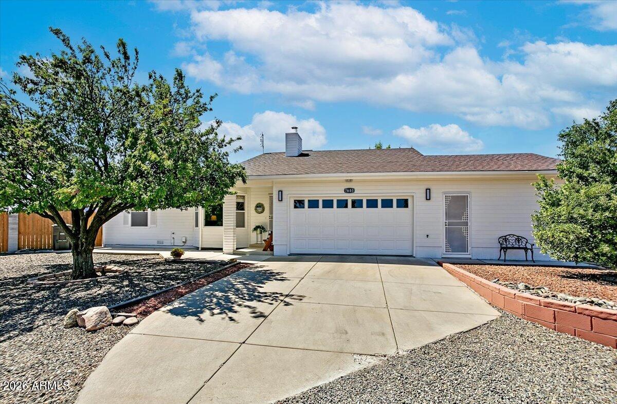 Welcome to this exceptional single-story home situated on a sprawling 0.638-acre lot, one of the largest properties in the community, ideally located at the end of a quiet cul-de-sac with no HOA. Offering 3 bedrooms, 2 bathrooms, and a versatile flex space, this property combines privacy, functionality, and endless possibilities. A welcoming covered front porch leads into a beautifully updated interior featuring wood and wood-look plank flooring throughout. The spacious kitchen is designed for both style and function with Quartz countertops, abundant prep space, fresh white cabinetry with modern hardware, a subway tile backsplash, stainless steel appliances including a gas range and stainless-steel range hood, and a pantry. Both bathrooms have been tastefully updated with modern... finishes. Enjoy year-round living in the screened-in Arizona room, overlooking the expansive fenced backyard featuring low-maintenance gravel, artificial turf, and a firepit, providing ample space to relax, entertain, or customize to your needs. The epoxy-floored garage includes a dedicated workbench area for hobbies or projects. Adding incredible versatility, the property includes an attached 330 sq ft casita with its own private entrance, perfect for guests, multi-generational living, or a home office. A separate 361 sqft detached building with skylights and a pool table offers endless possibilities as a workshop, game room, studio, home gym, or business space. With an oversized lot, exceptional outbuildings, and modern updates throughout, this is a truly rare opportunity to own one of the most unique properties in the community.