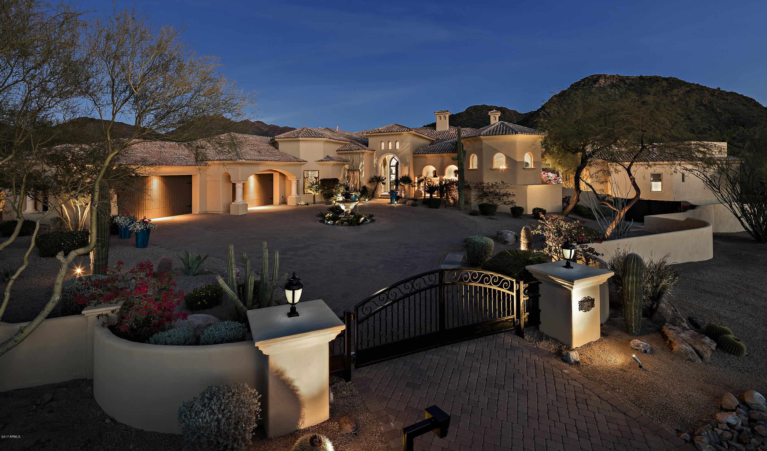 Welcome to your privately gated retreat tucked away in prestigious North Scottsdale perfectly positioned on 1.6 acres boasting 360 deg mountain & city views & resort style backyard. $1m+ spent in updates & upgrades make this home one of a kind. Desirable, spacious floor plan, split bedroom set up provides privacy & functionality. 5 spacious bedrooms, 2 his/her office options, guest wing w/ 3 oversized en-suite bedrooms & sitting/TV area. Amazing entertaining options in detached 2000sf guest house overlooking sparkling pool & spa. A true entertainers paradise w/full guest suite, professional theater, full bar & soaring ceilings. Access the large view deck for sunset cocktails & billion dollar city & mountain views. Backyard features multiple options-recreation dining, relaxing & star gazing