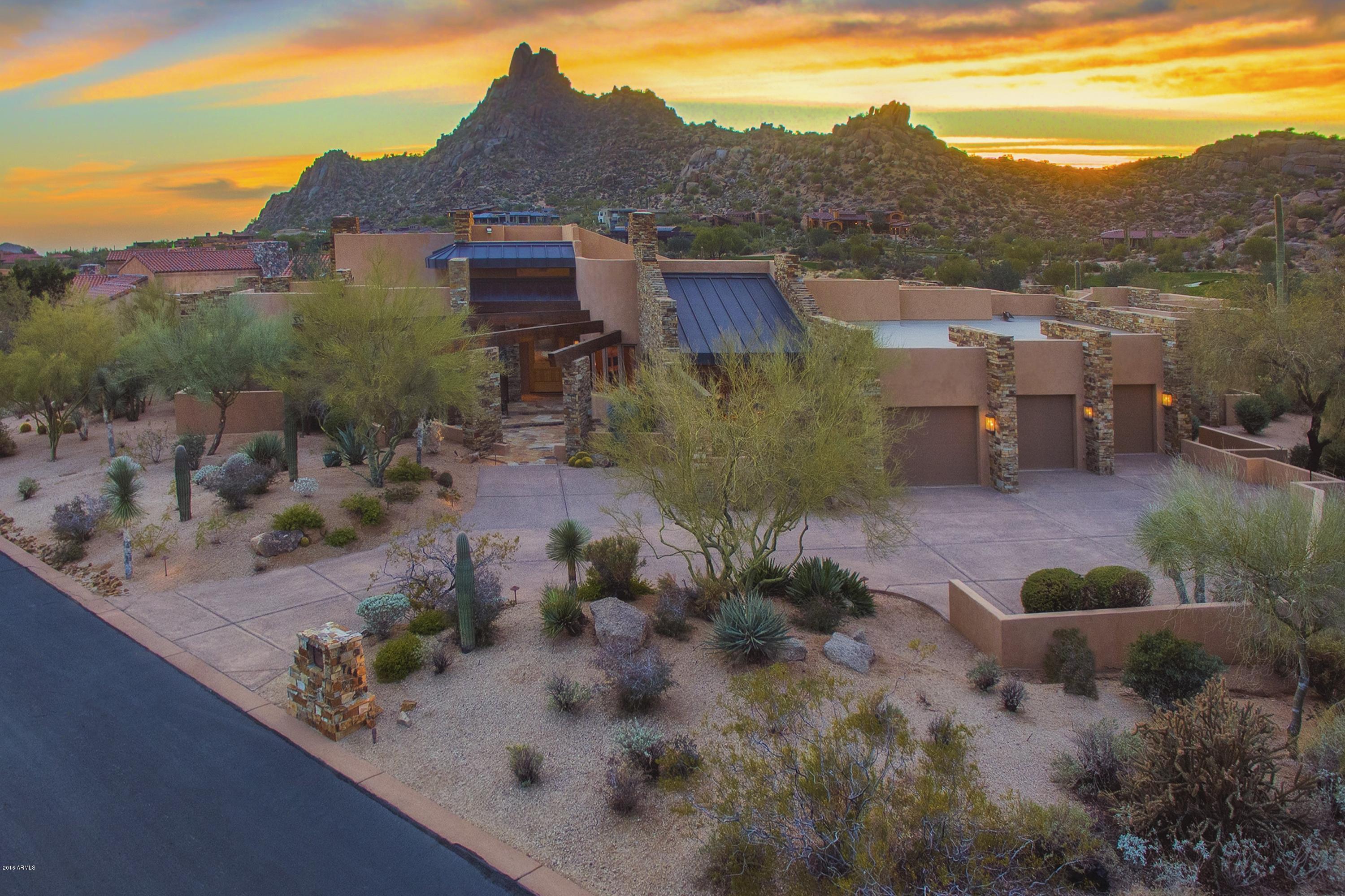 Elegant southwest contemporary designed by James Hann and sited on one of the best lots in Estancia with unobstructed golf course and Pinnacle Peak vistas * Modern floor plan characterized by the generous great room and adjoining chef's kitchen, master suite split from the guest wing, office/den with full bathroom and separate guest casita complete with sitting room, wet bar and ensuite bedroom * Architectural details include a cohesive blend of stone, glass, wood and copper materials * The interior details include stone and wood flooring, beamed ceilings, stone slab counters, furniture-grade cabinetry, designer appliances and whole-home automation system * The southwest-facing backyard is perfect for entertaining and includes a heated pool & spa, multiple patios, gas fireplace with sitting area and built-in BBQ island *