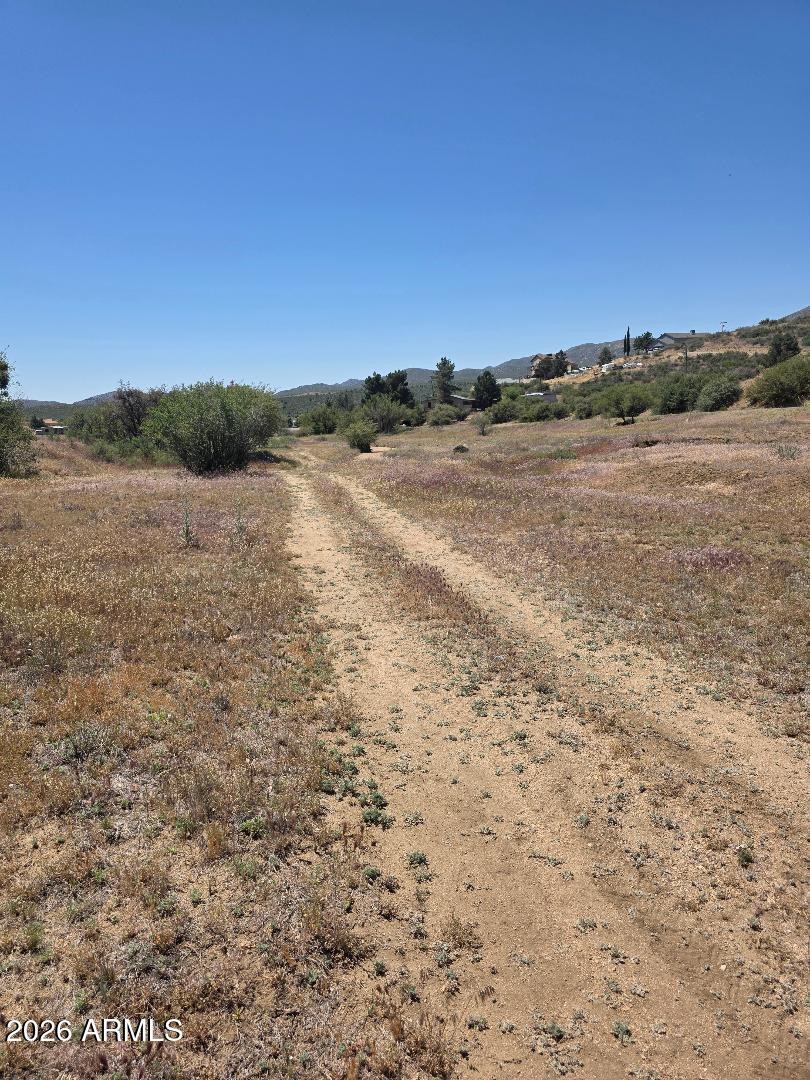 Come take a look at this beautiful  1/4 acre lot.  Enjoy this peaceful area. Build your dream home., workshop or whatever your heart desires. Natural vegetation. No flood. 
Flat, usable area.  Easy access to property. 
Make this property your weekend getaway.
Easy access to Hwy 89 to Prescott or Wickenburg.
