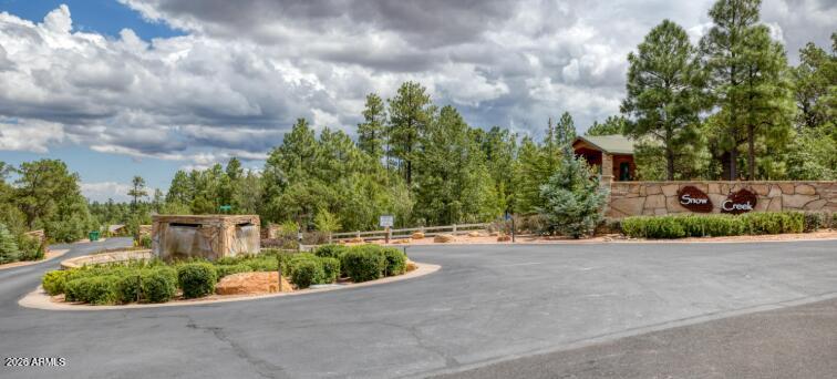 A combo of two lots tucked away on a private cul-de-sac within the highly coveted gated community of Snow Creek. Lot 160 is 0.53 acres and lot 161 is 0.47 acres. This is a rare opportunity to build a custom home surrounded by luxury custom estates, towering pines, and exceptional privacy. Many neighboring homeowners have combined multiple lots to create expansive private retreats, adding to the exclusive feel of the community. Snow Creek is known for its beautifully maintained walking trails, abundant open space, and peaceful mountain setting, all while offering surprisingly low HOA dues. Community improvements include paved roads and underground utilities, including natural gas, city water and sewer, power, cable TV, and telephone service. Perfectly positioned near shopping, dining, and everyday conveniences, yet just moments from the National Forest, this property offers the ideal balance of seclusion, nature, and accessibility. A premier setting for a luxury mountain getaway or full-time custom residence.