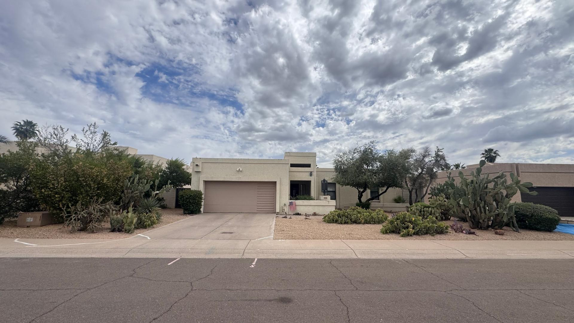 Great location! Close to major shopping and restaurants, with Kierland just minutes away. This 3 bed, 2 bath home features a spacious great room with a separate dining area, plus a kitchen with an eat-in space. Tile flooring runs throughout, with carpet in the bedrooms. Enjoy multiple sliding glass doors that open to a fully covered patio and backyard, perfect for indoor/outdoor living. The hall bath includes a walk-in shower, while the primary suite offers a tub/shower combo, dual sinks, and a walk-in closet. Youll also find a laundry room just off the kitchen and a roomy 2-car garage with built-in shelving.  Two A/C units, and low-maintenance desert landscaping. Homes like this dont last long, and all appliances are included, with electric stove and dishwasher.