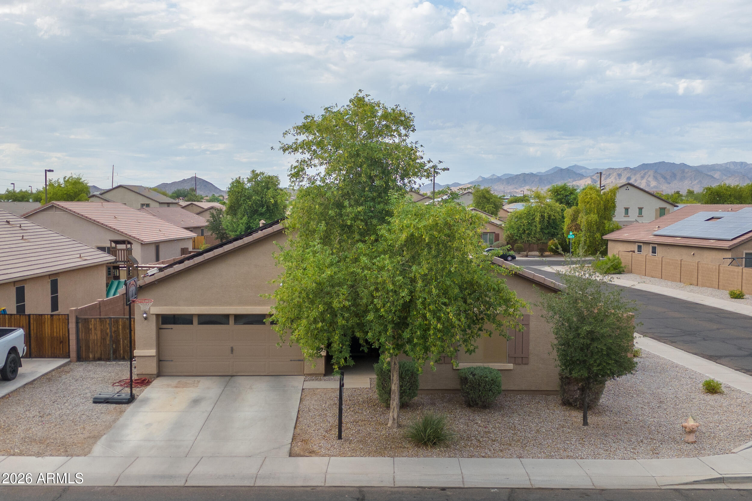 WELCOME TO 25404 W FREMONT COURT. ENJOY THE BREATHABILITY OF BEING ON A CORNER LOT. WALK IN TO A SPACIOUS SPLIT FLOOR PLAN. 3 BEDROOMS IN THE FRONT OF THE HOME WITH THE PRIMARY PRIVATELY SEPARATED IN THE BACK CORNER. THE MASTER BEDROOM IS VERY LARGE AND HAS A BATHROOM EQUIPPED WITH A GARDEN TUB AND WALK IN SHOWER. KITCHEN HAS ELECTRIC APPLIANCES AND A LARGE STAINLESS STEEL REFRIGERATOR. BACK YARD HAS GRASS AND IS A GREAT SIZE FOR ENTERTAINING .
THE SIDE YARD DOES HAVE A 10 FT WIDE DOUBLE SWING GATE. LEASED SOLAR PANELS TO BE ASSUMED BY NEW BUYER. PLEASE TAKE A LOOK TODAY!