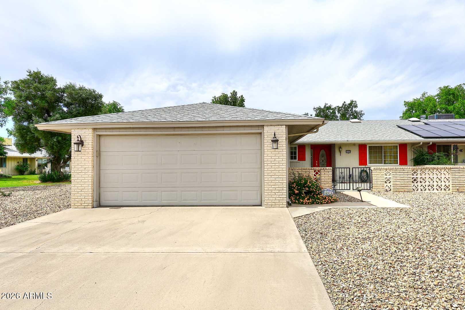 Welcoming Twin Home in Sun City directly across the street from the popular Sundial Recreation Center. It offers a wide range of ammenities including 100 ft outdoor pool, indoor pool + indoor pool w/ ramp access & relaxing whirlpool spa. Variety of activities: bingo, card games, mini golf, billards/pool room+ fitness center and more. Residents can enjoy numerous social clubs & live concerts-making it easy to stay active, social and entertained. Home has plush carpeting w/ upgraded pad complemented by light/toned tile floors. The updated kitchen has generous cabinetry , stylish  Corian counters, built-in appliances w/ microwave + sunlit breakfast nook w/ lovely bay window. Interior windows are designed to significantly reduce outside noise. Cozy backyard w/ shaded patio. Great Value!