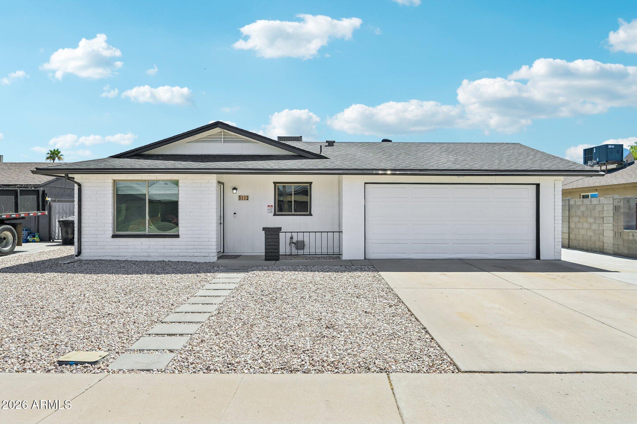 Move-in ready Mesa home with premium energy upgrades, no HOA, and a backyard full of possibility. This single-level 3-bedroom, 2-bath home offers 1,228 sq ft on a 7,471 sq ft cul-de-sac lot, with a 2-car garage prewired for an EV charger. Charger not included. The standout feature is the paid-off Tesla solar system with 36 panels and two Tesla Powerwall 3 units for whole-home backup, giving the next owner a major energy upgrade without assuming a solar lease.  Inside, the home feels fresh and inviting with new carpet, fresh interior paint, tile in the main living areas, granite countertops, stainless steel appliances, electric range and oven, dishwasher, ceiling fans, and a private primary suite with its own full bath. The backyard is a major highlight: large, open, and ready for the nex owner's vision. An uncovered back patio sits directly off the rear door, creating an easy space for outdoor dining, grilling, lounging, or entertaining. The yard also offers room to explore a future pool, garden, play area, guest space, or Accessory Dwelling Unit. Based on Mesa's ADU size rule, the property may support an ADU up to approximately 921 sq ft, subject to buyer verification, setbacks, permits, and city approval. Recent improvements include new carpet, fresh interior paint, new exterior doors, updated front rock-and-paver landscaping, and a 10x10 backyard storage shed. Located near the Gilbert Rd/Main St light rail extension, Downtown Mesa, Mesa Arts Center, dining, shopping, and ASU at Mesa City Center.