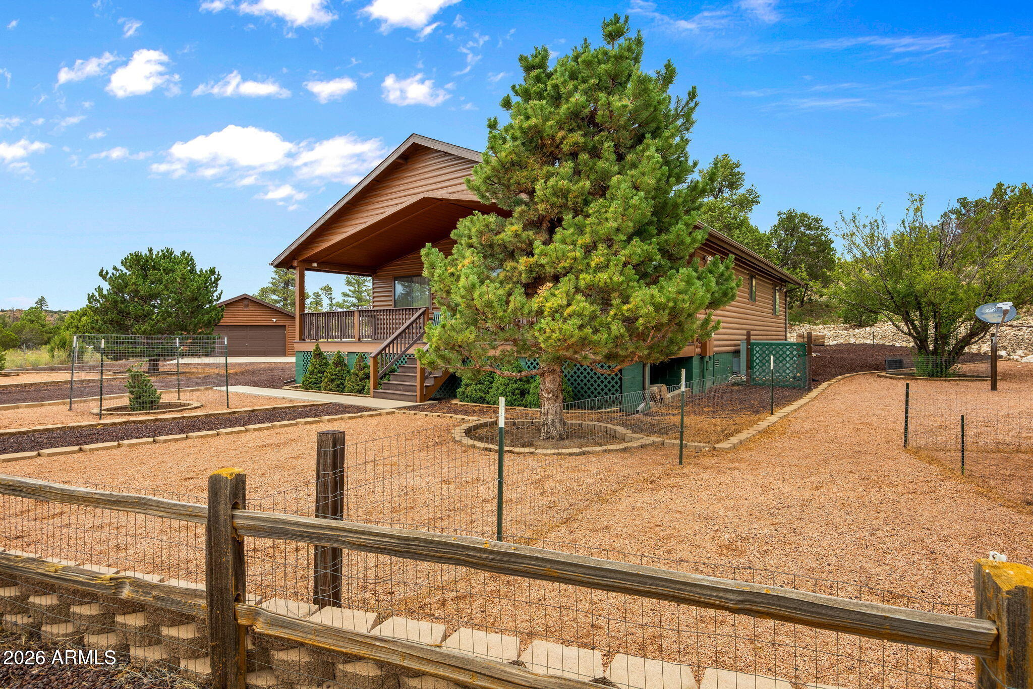 Welcome home to this charming 3-bedroom, 2-bath home on 1.06 acres backing Sitgreaves National Forest! Offering 1,520 sq. ft. of comfortable living space, this well-designed split-bedroom floor plan provides privacy and functionality. Relax or entertain on the covered front and back decks while enjoying the beautifully landscaped yard. The detached extra-deep garage offers ample room for vehicles, storage, or a workshop. With space to spread out both inside and out, this property combines peaceful country-style living with everyday convenience. Don't miss this opportunity to make it yours!