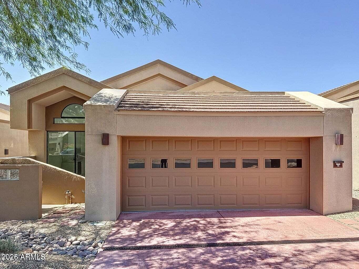 Totally remodeled 2025 Designed by renowned Architect, Award winning Vernon Swaback of Taliesen Frank Lloyd Wright school. Impeccable vistas of Mtns, high Sonoran desert. All SINGLE level home, No COMMON WALLS, located in 24/7 GUARD gated Troon Village. Golf/Tennis community. Exclusive Ballantrae Ridge HOA private features community pool, Spa and fitness club house included. Perfect ''lock and leave' with low maintenance. Soaring ceilings. Designed windows. Metal rolling shields at patio doors. Contemporary cabinetry, gourmet appliances. custom built-ins , custom quality finishes throughout. Prestigious Scottsdale address. Golf, tennis and Country Club privileges available. Come see this unique offering