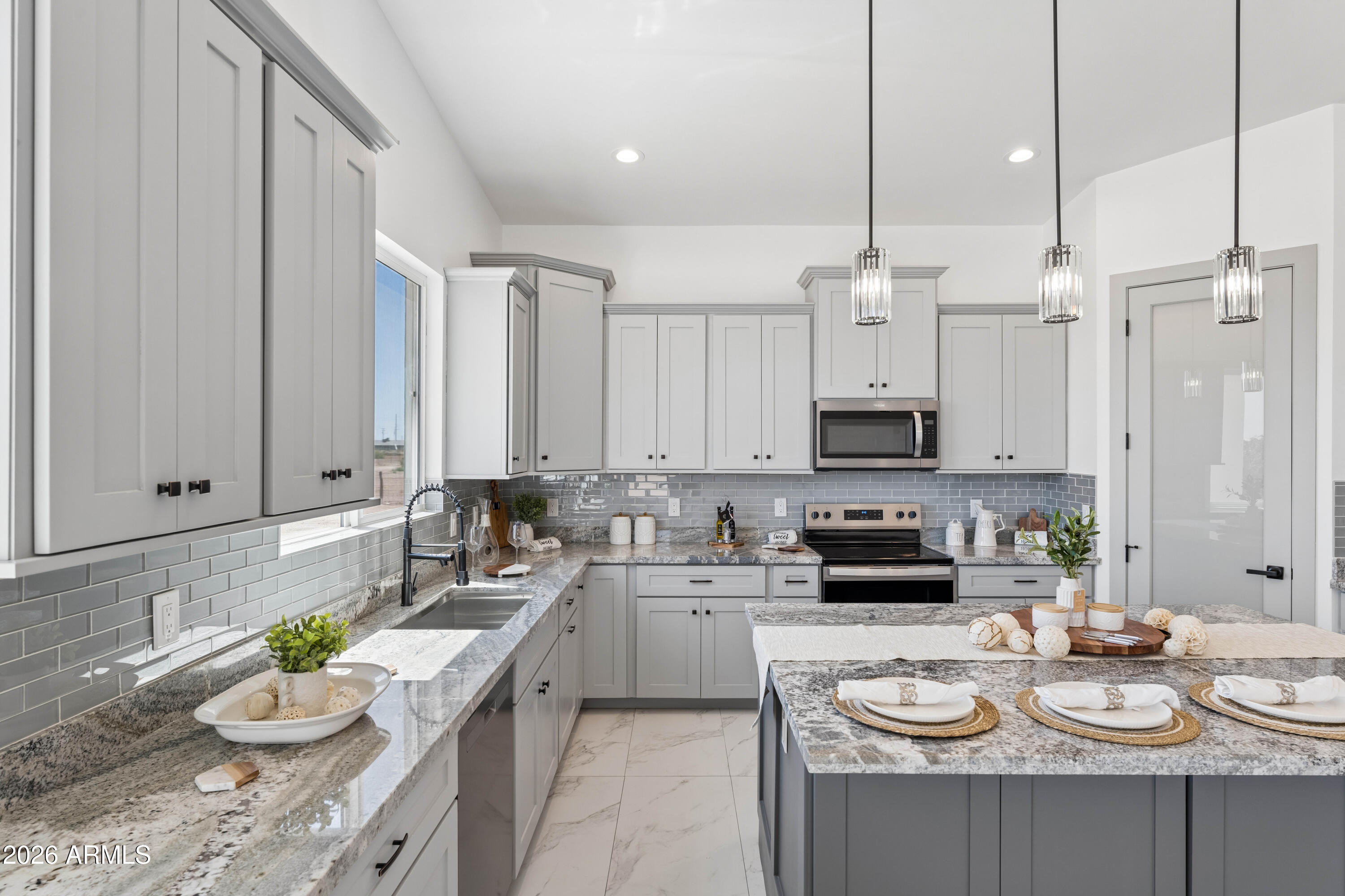 $20,000 BUILDER INCENTIVE AVAILABLE! Use toward closing costs or an interest rate buy-down to help make your dream home more affordable.
Stunning NEW 4 bed, 3.5 bath home in Tonopah with modern desert design, soaring ceilings, oversized doors, and an open-concept layout full of natural light. Approx. 3,224 SQFT under roof (2,297 livable) featuring Alpino White 20x40 porcelain tile and elegant finishes throughout.
Beautiful kitchen with large island, custom-style cabinetry, and appliances backed by a 2-year warranty. Split floor plan with a spacious primary suite and walk-in closet.
Large lot with room for RVs, toys, animals, pool, workshop & more. EV charging capability, future BBQ setup, and shared well servicing only 2 homes. Welcome home!